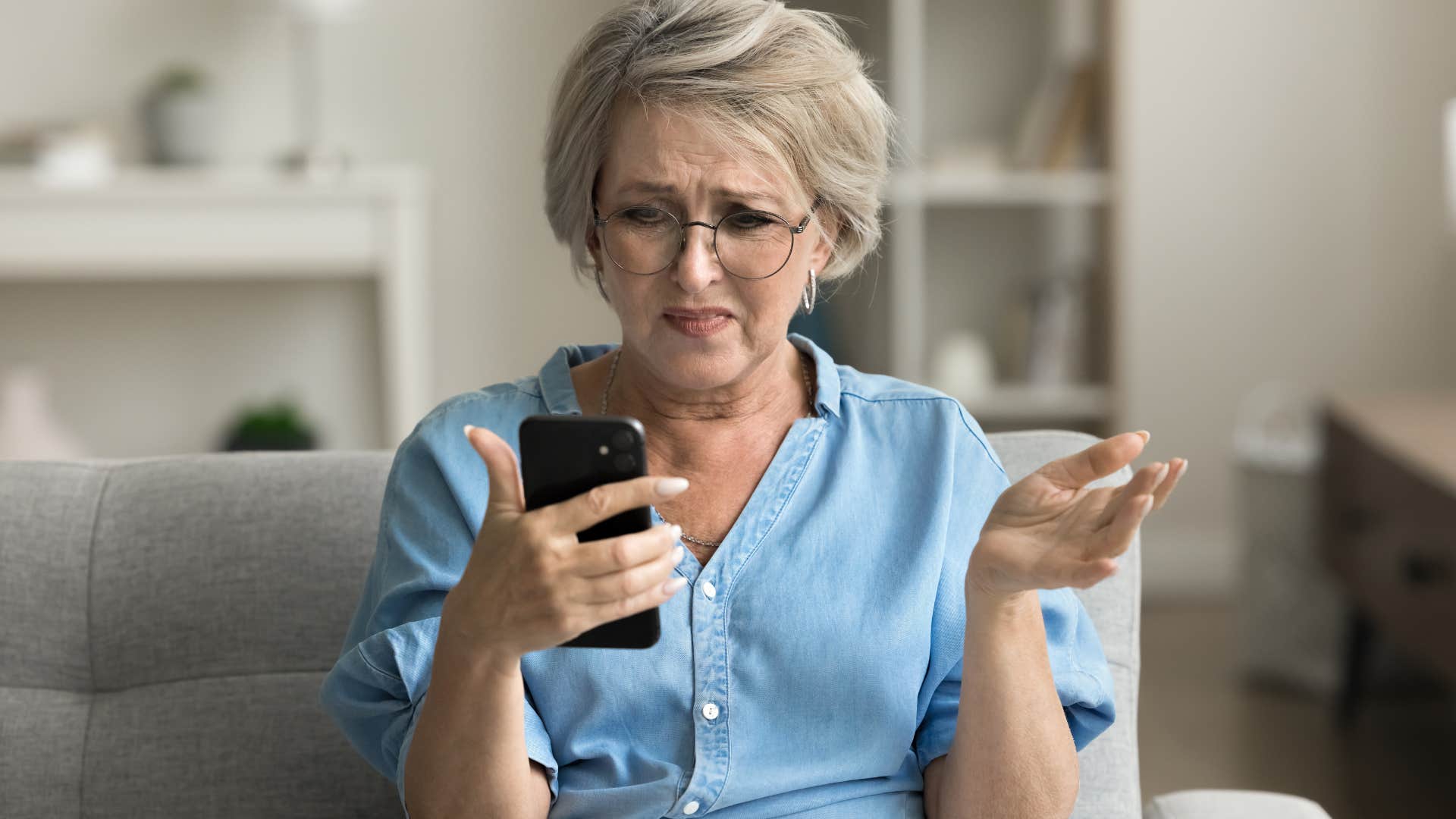 woman who judges people based on money looking at her phone