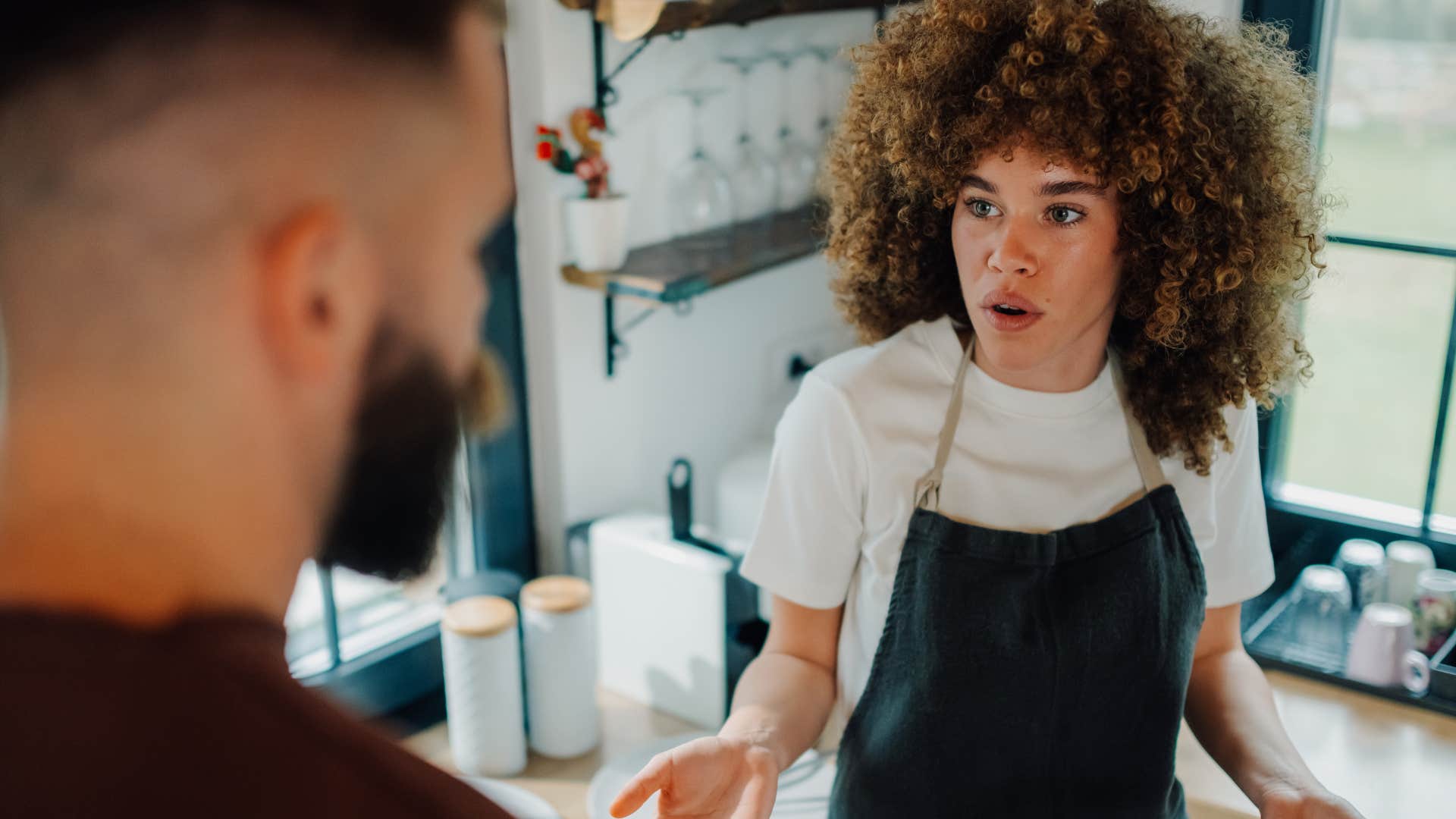 woman arguing with a man who tipped service workers poorly