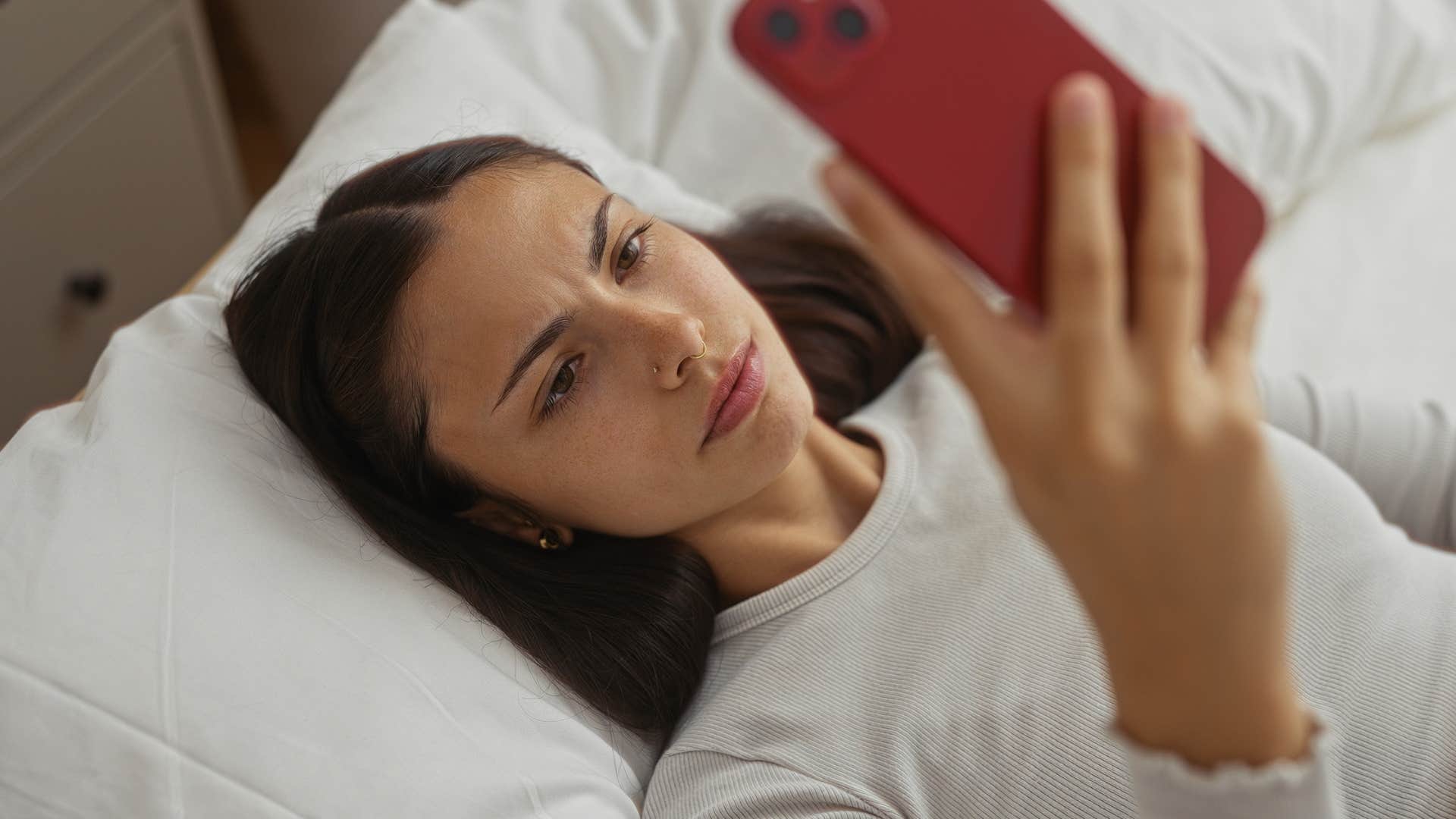 woman struggling to maintain deep connections scrolling on her phone