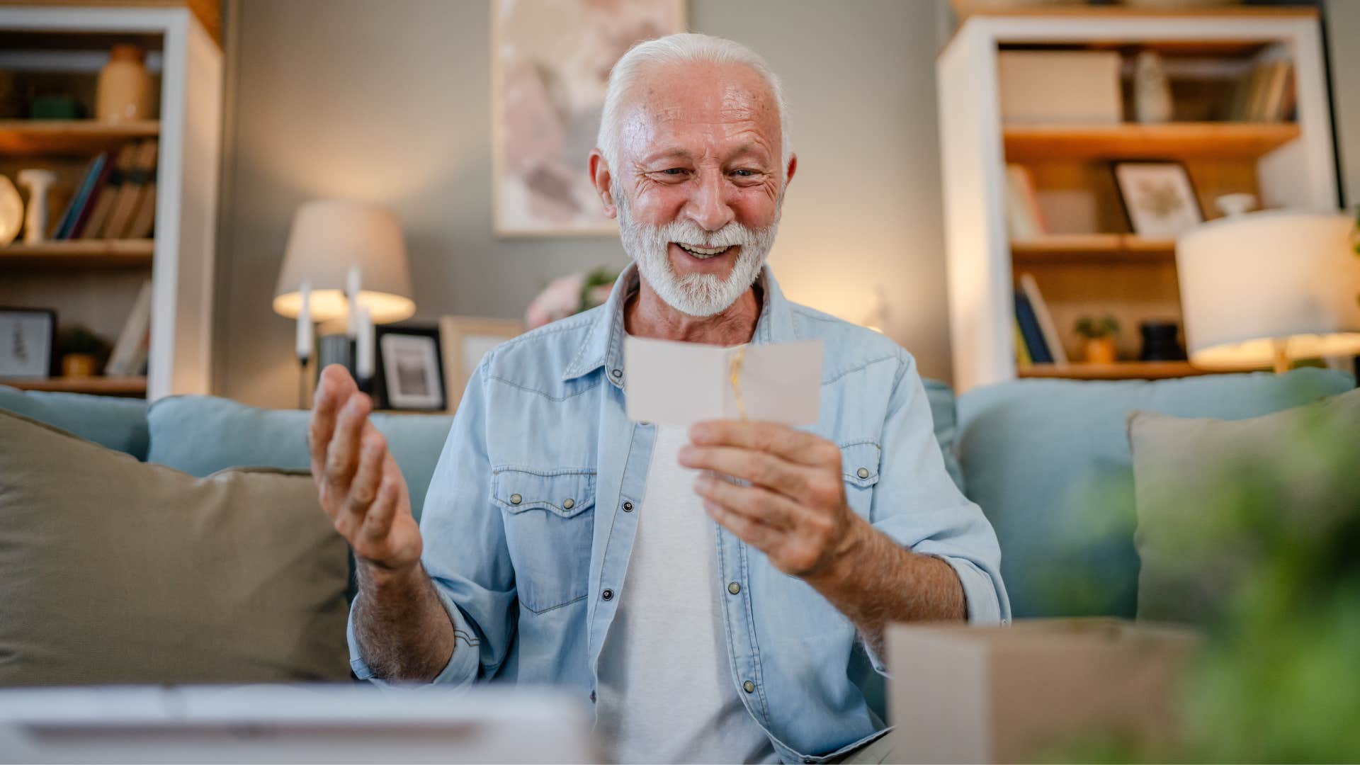 a boomer man displays all of his grandkids awkward school photos