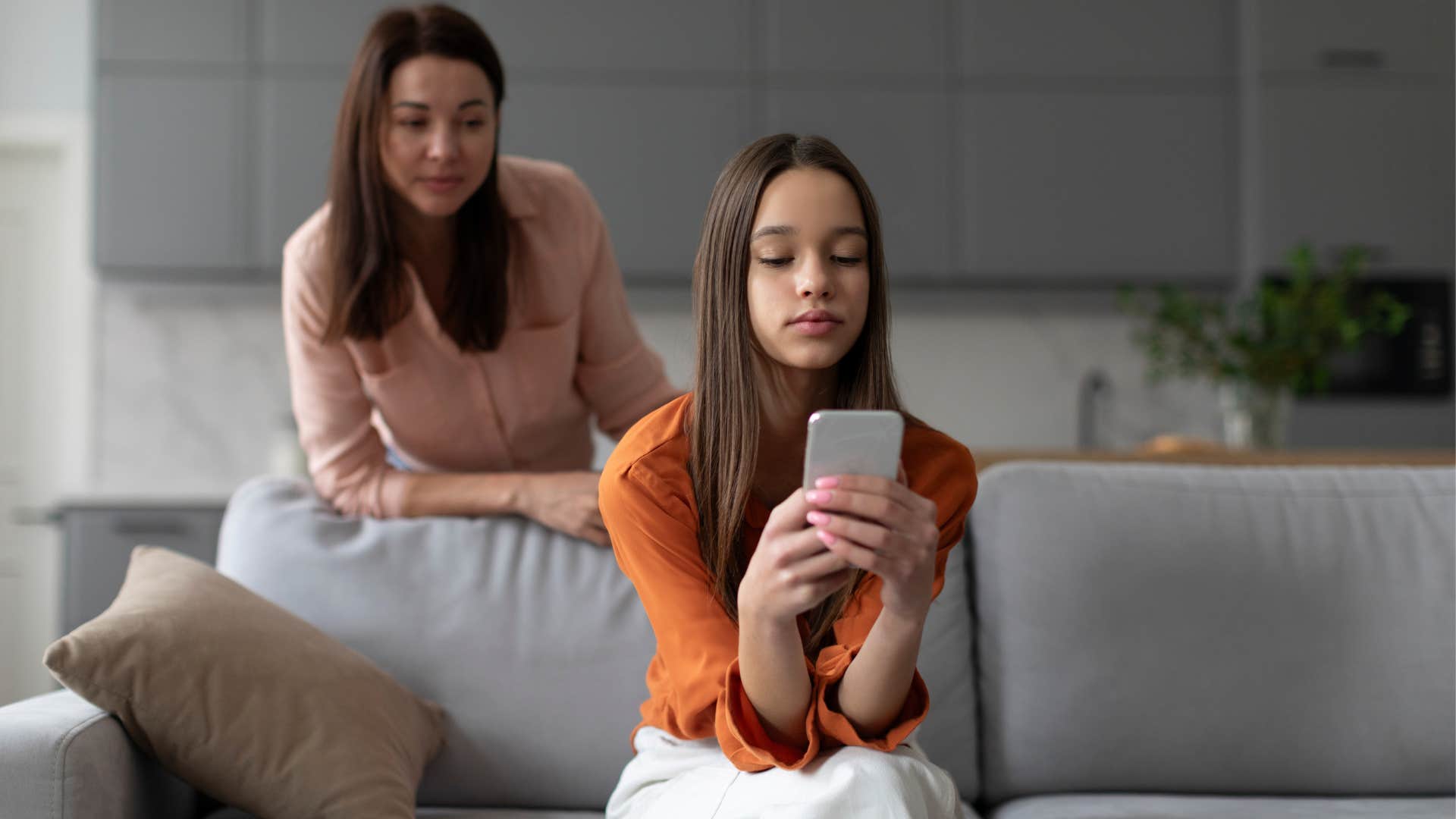 gen x mom trying to speak to daughter distracted by her phone
