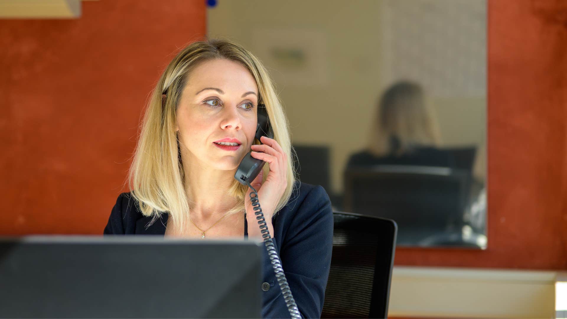gen x woman using landline phone