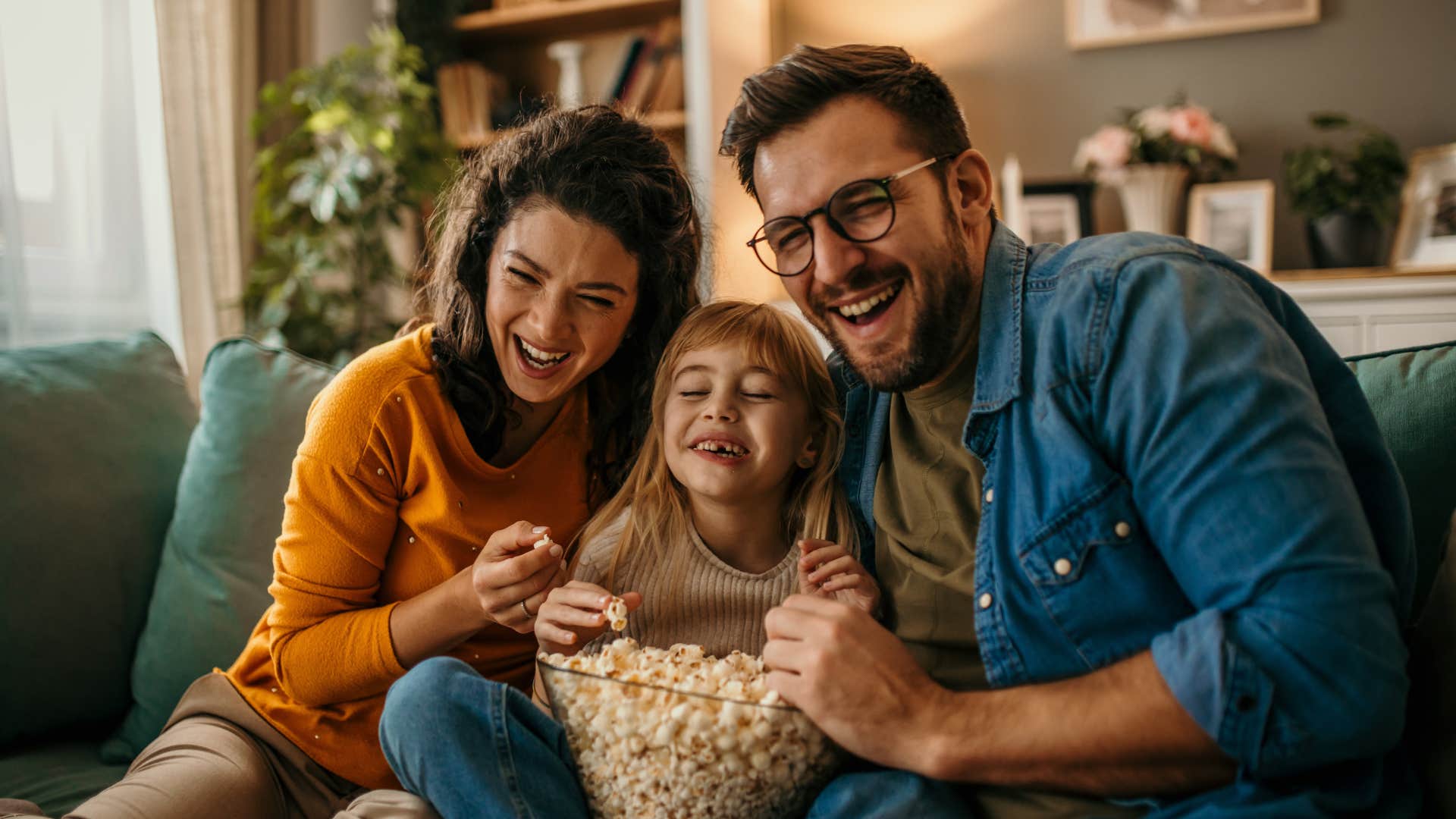 family sitting down to watch a movie together