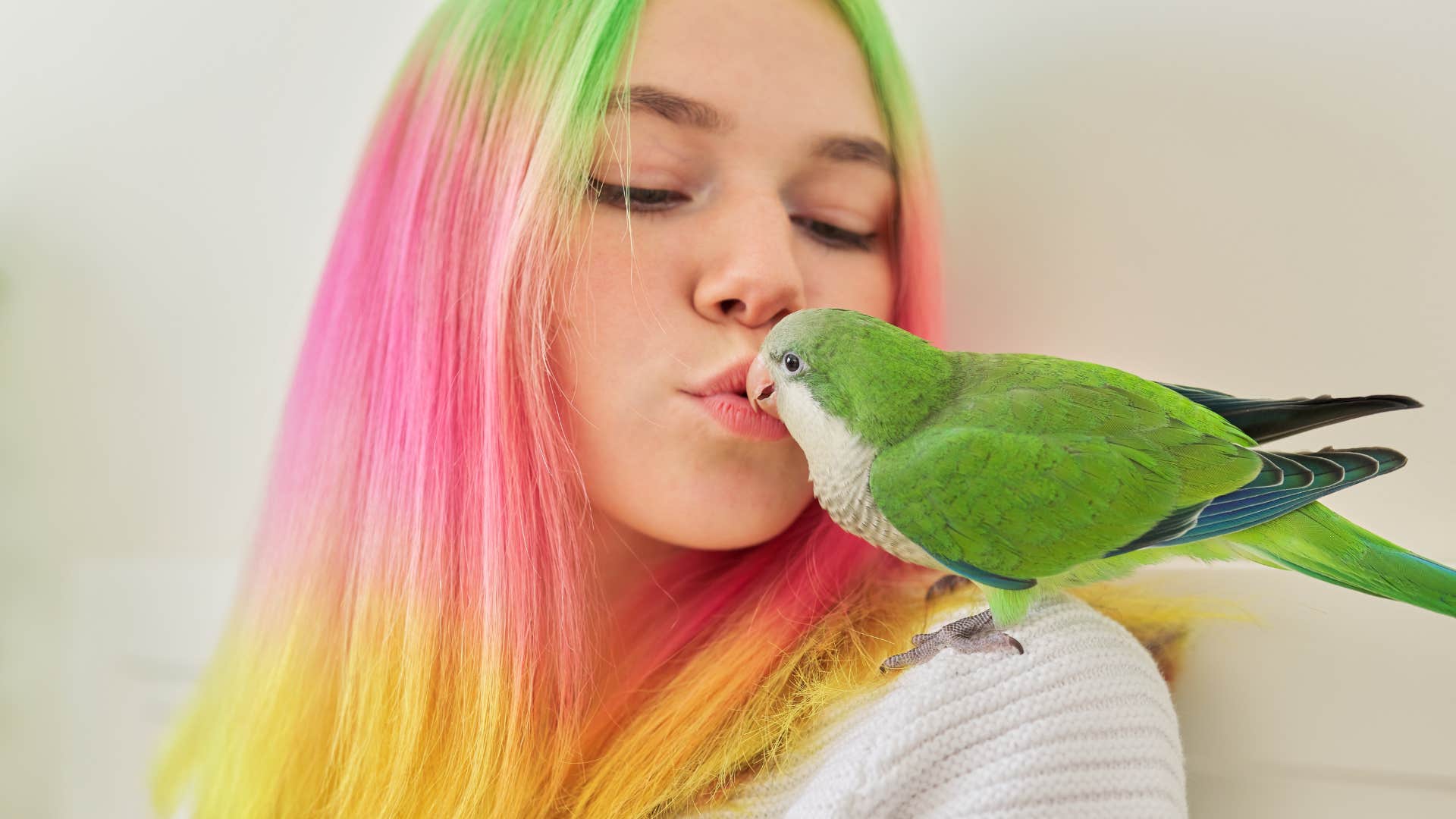 bird sitting on owners shoulder knowing shes emotionally unstable