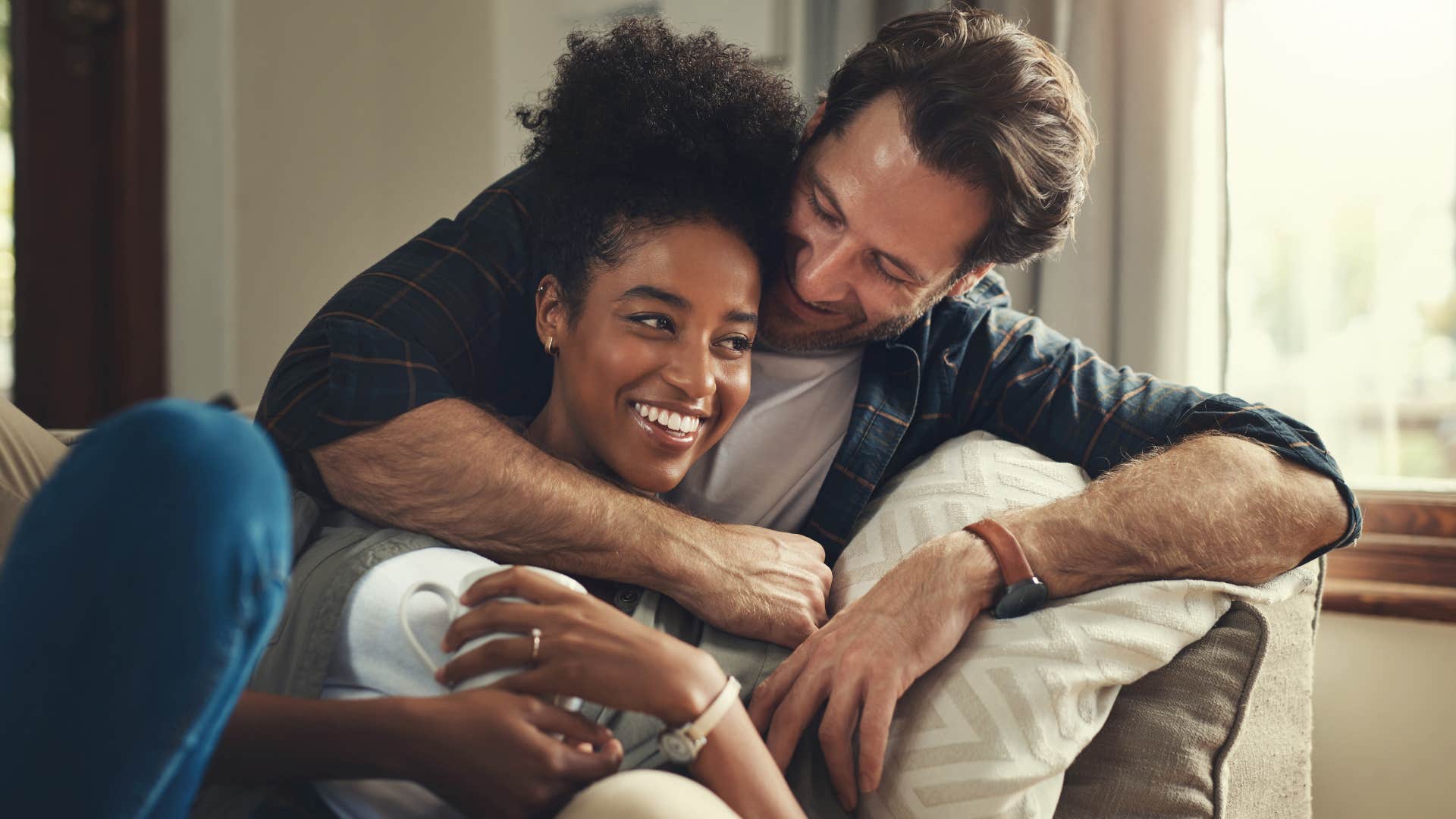 couple laughing together snuggling