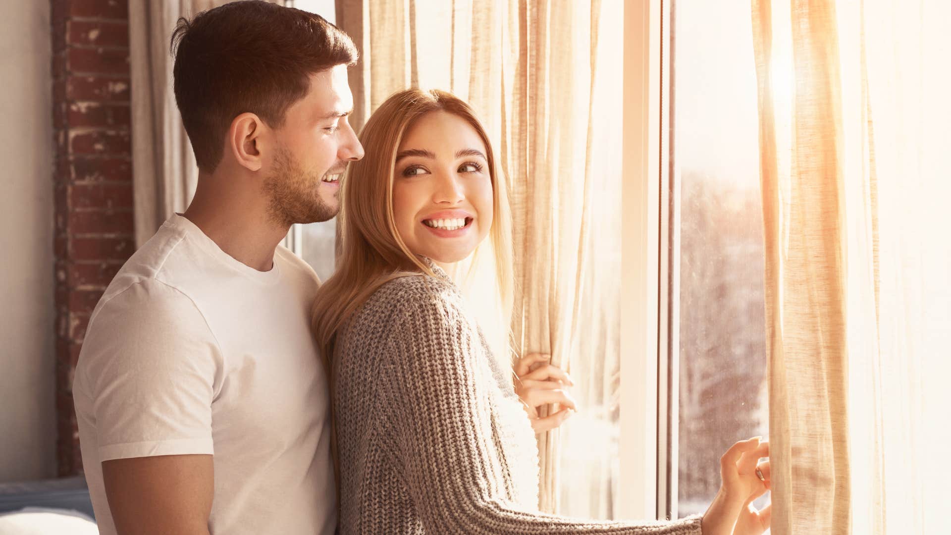 happy couple sharing a space after moving in together