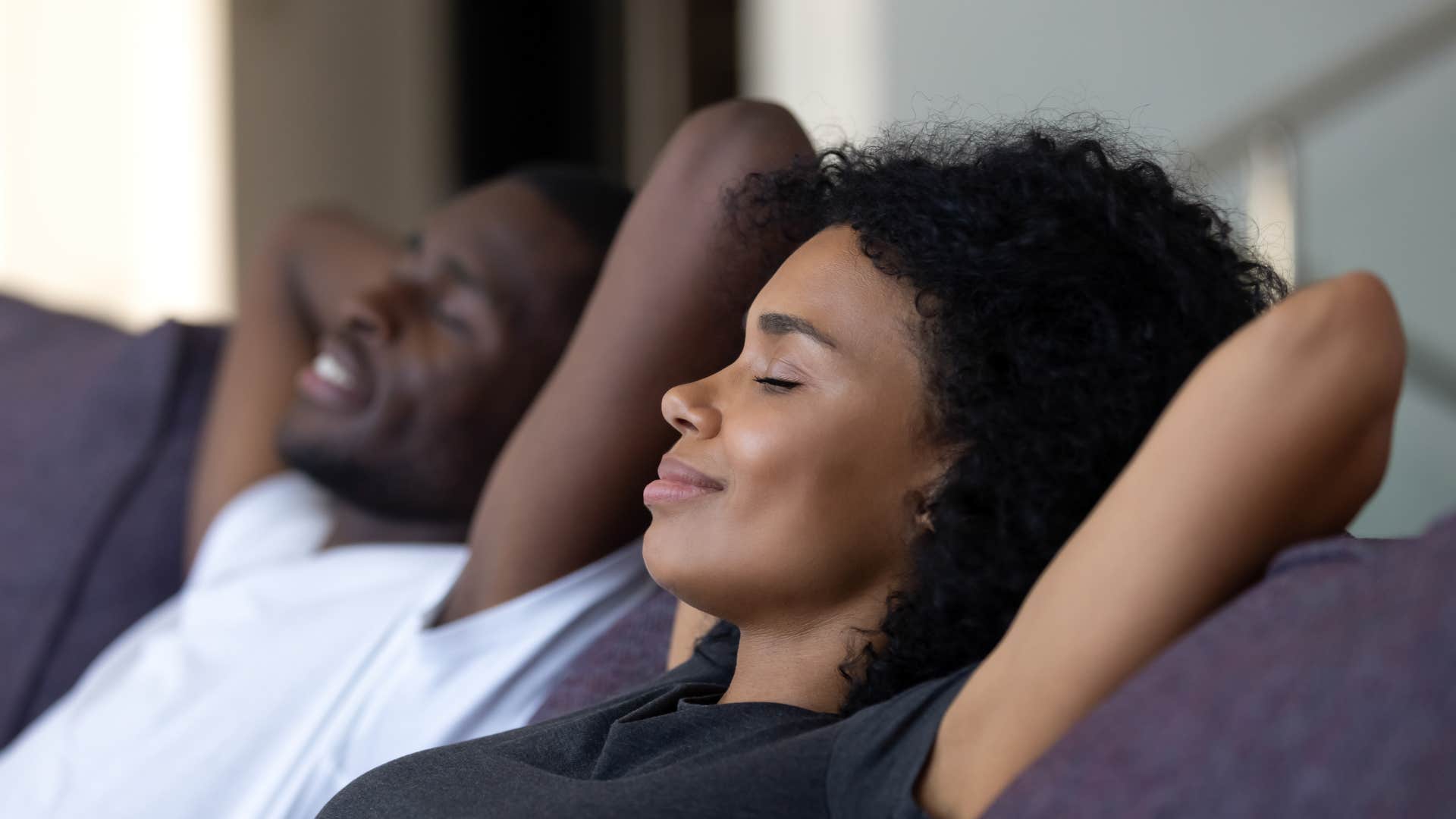 couple smiling sitting comfortably in silence