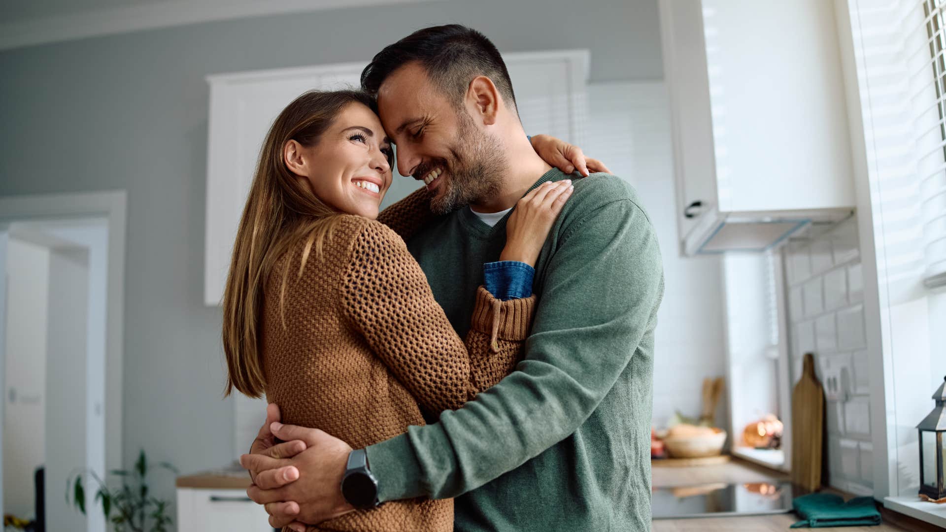 couple smiling while they support each other through everything that comes their way