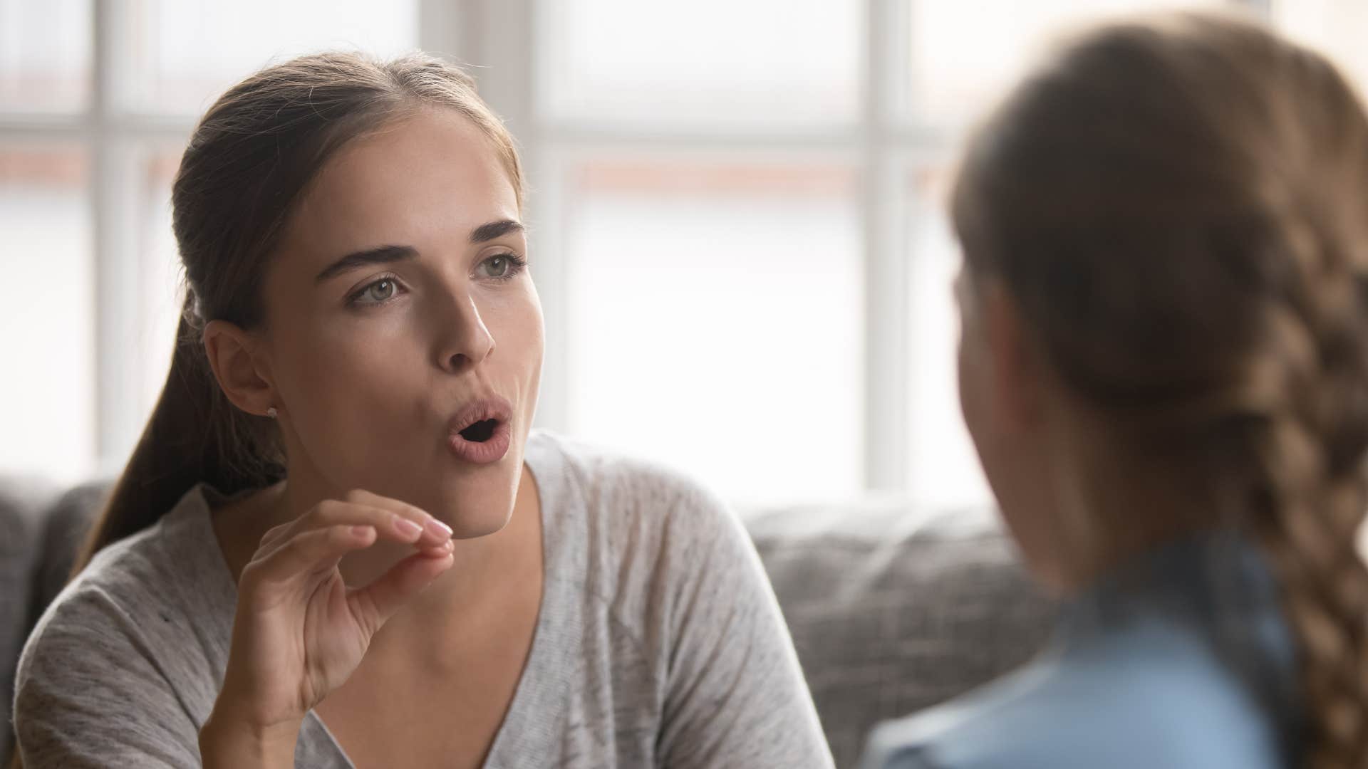 woman correcting her friends grammar in the middle of a conversation