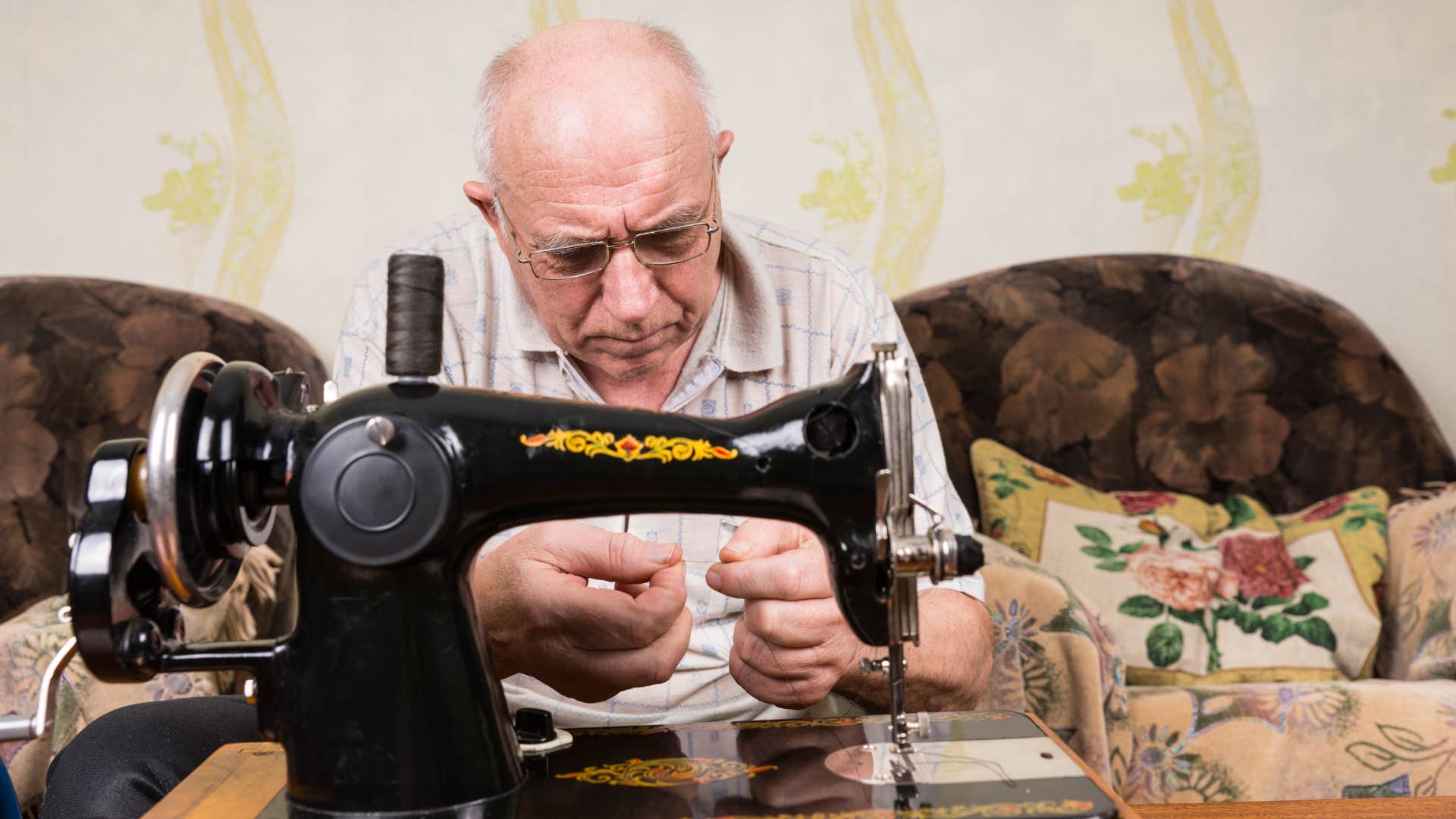 Man sewing clothes