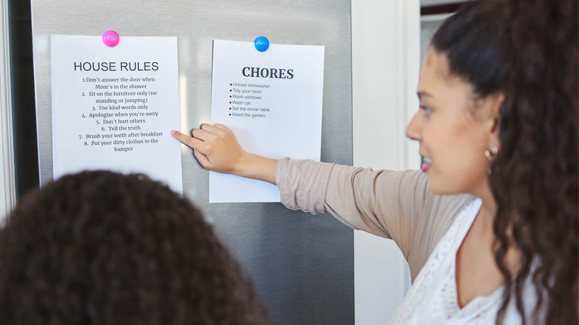 a mother shows her daughter the to do lists