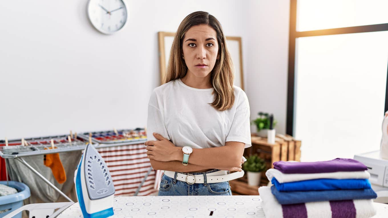 Things Unhappy Wives Think About While Folding Laundry And Fantasizing About Leaving Their Husbands angry upset wife fed up while doing laundry