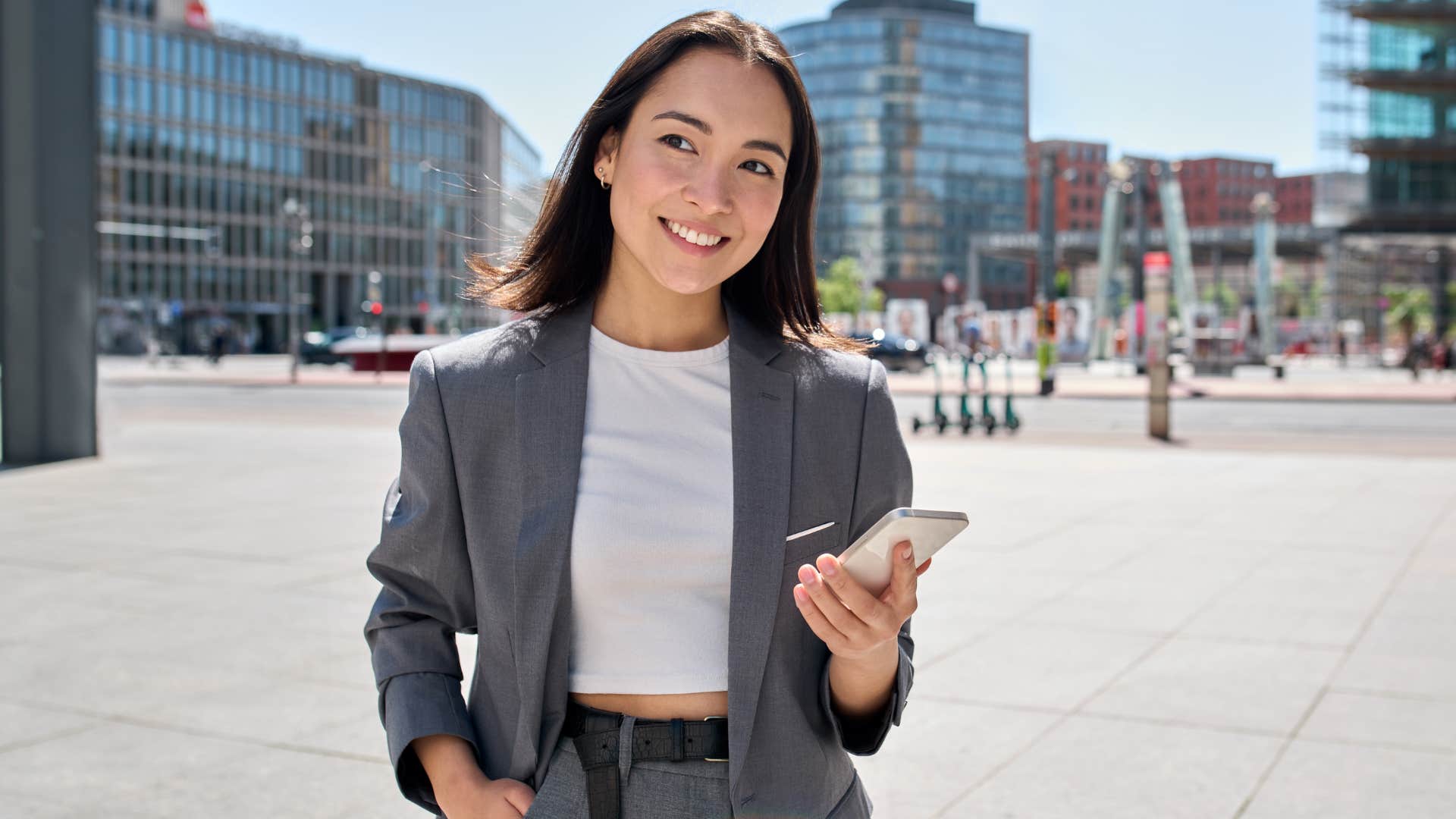 Woman smiling and walking around company retreats.