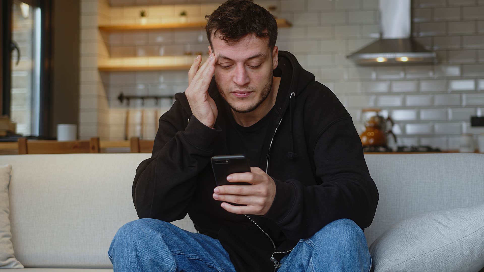 Man scrolling on his phone and online dating.