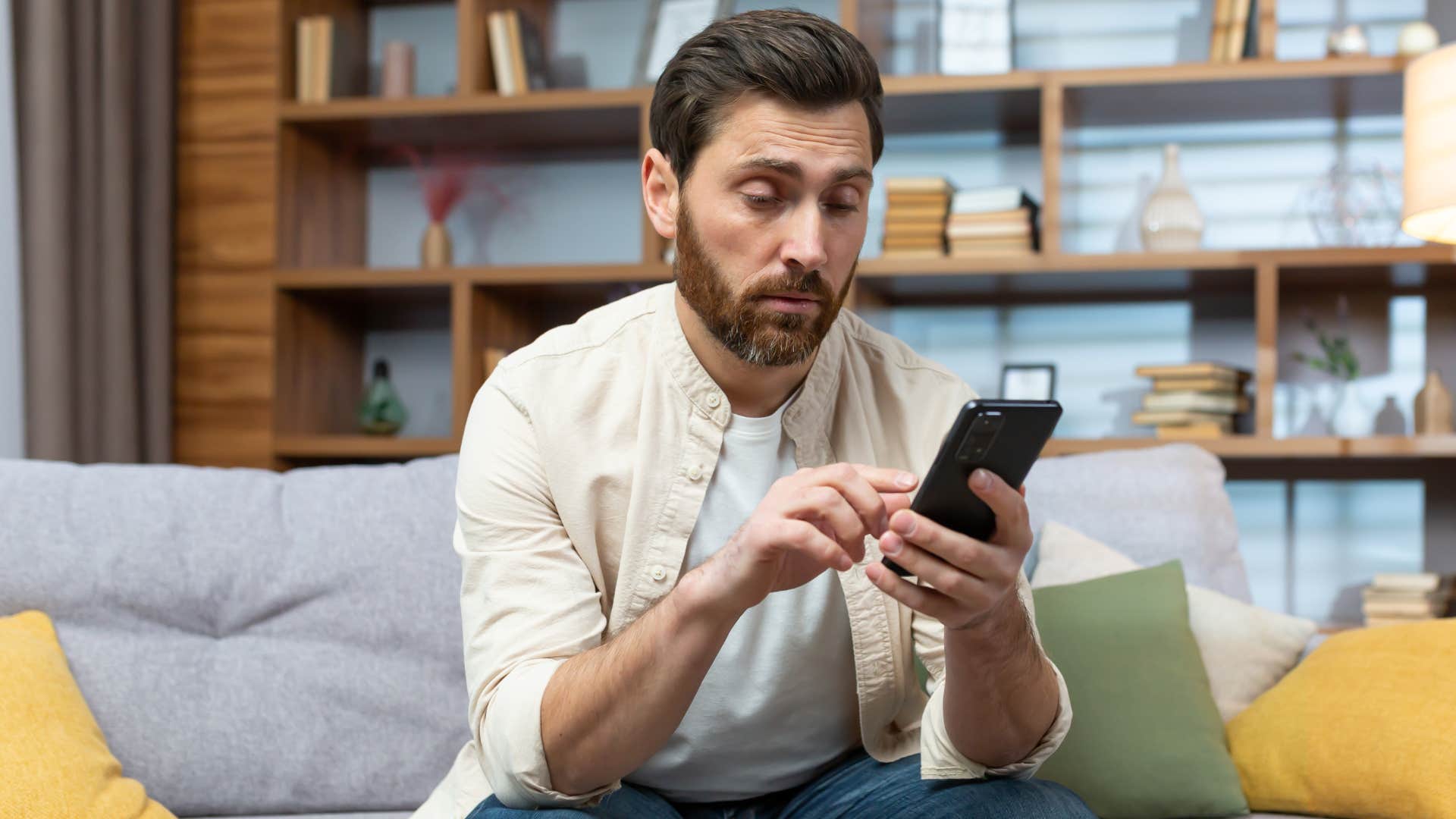 Man texting on his phone.