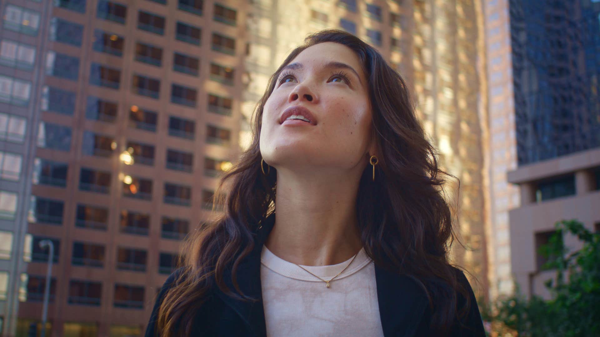 woman looking up thinking about the future