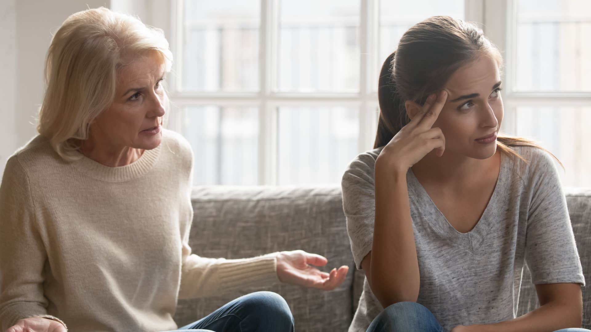 woman ignoring mother telling her what to do