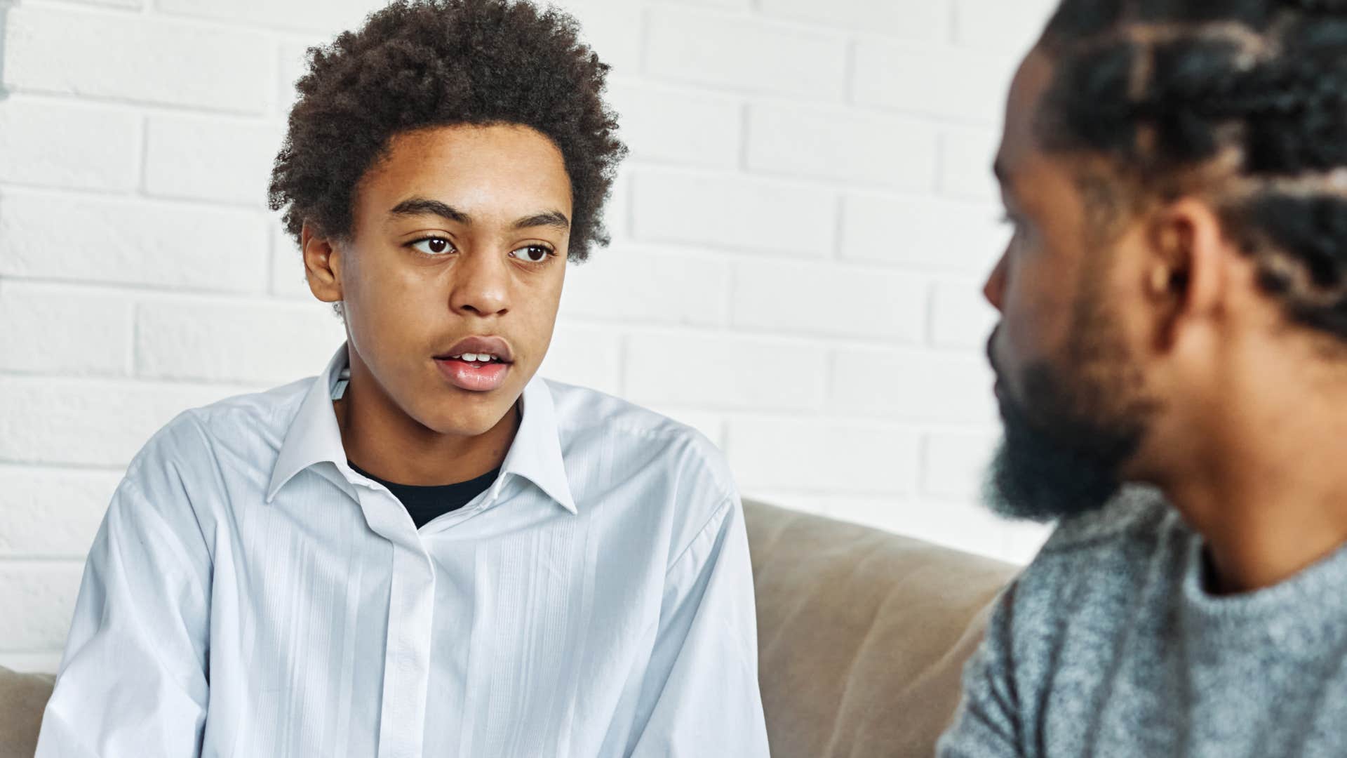entitled teenage boy being unkind talking to his dad