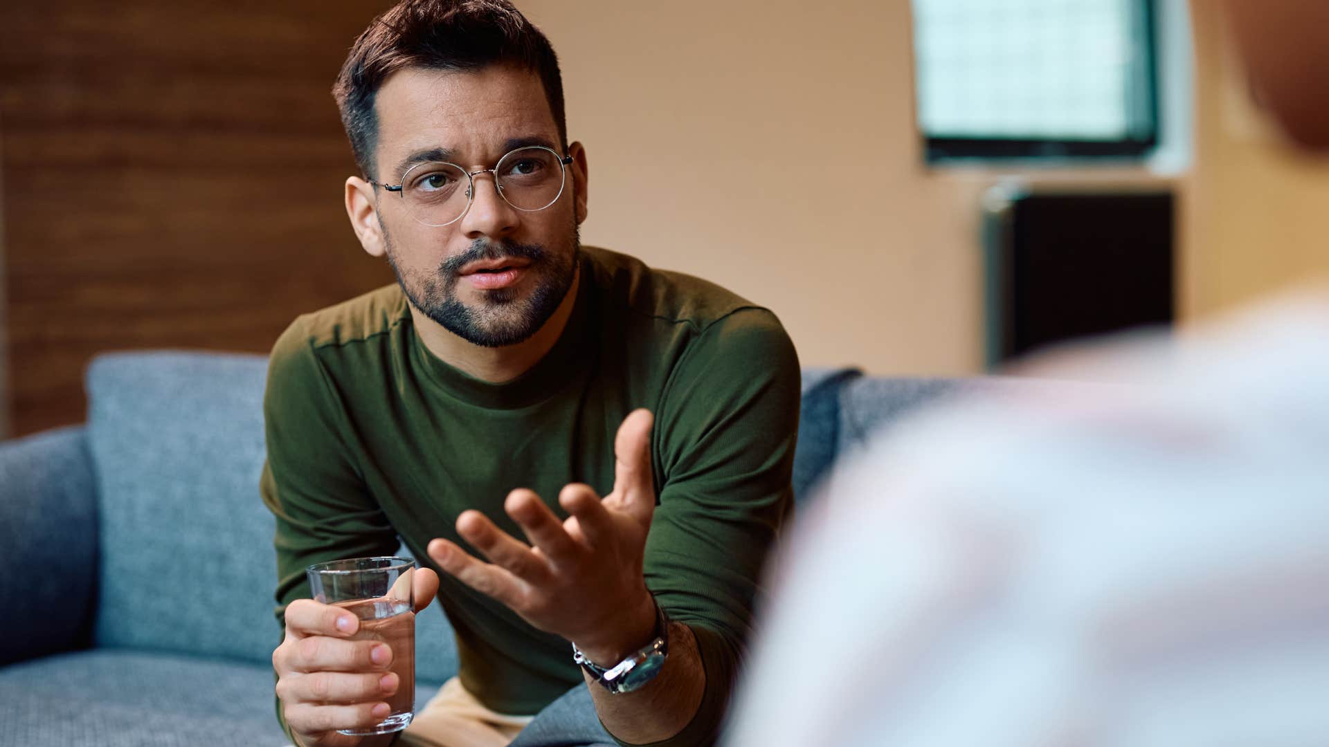 wealthy man who has a misguided view of hard work talking to co-worker