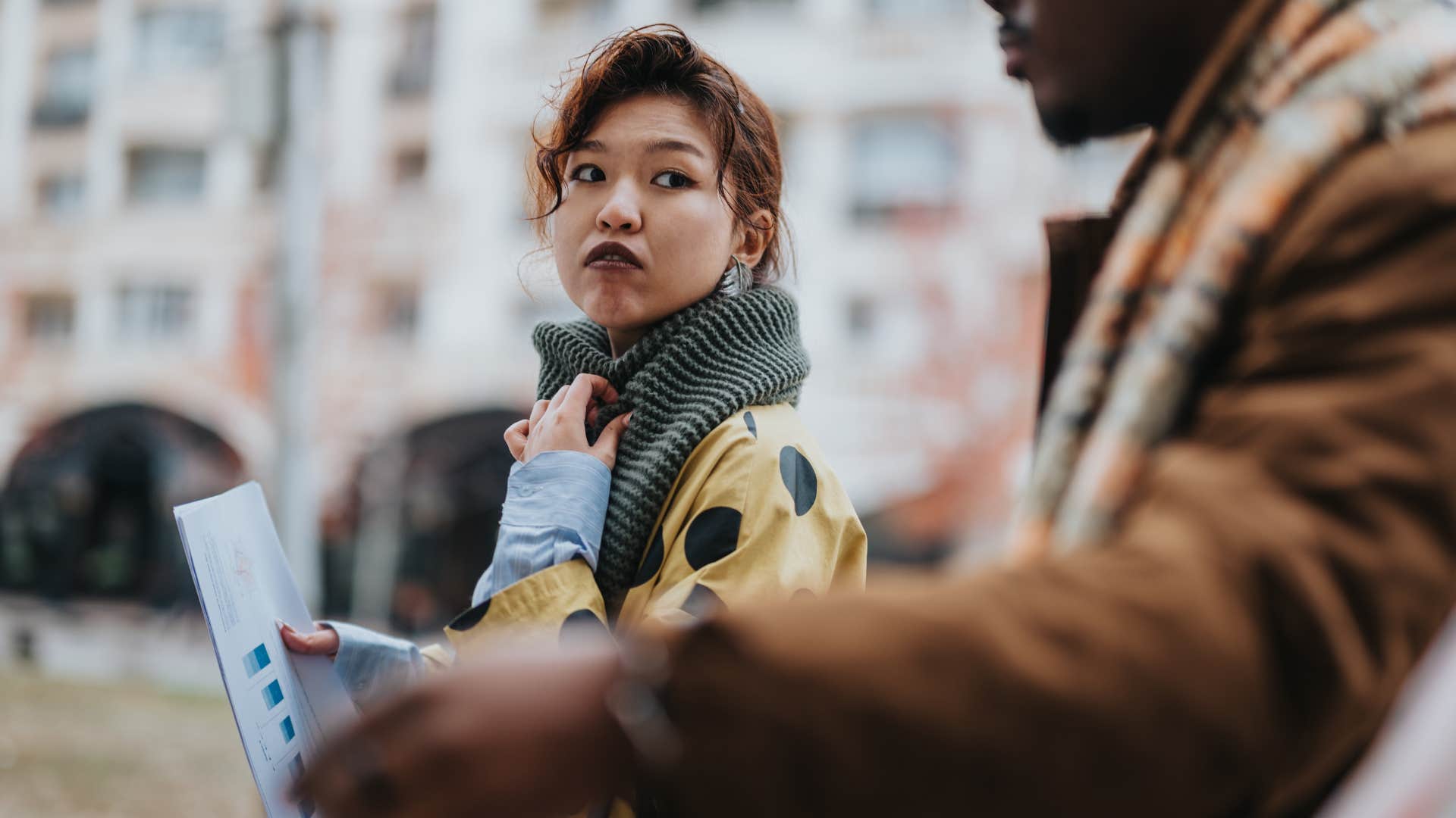 woman listening to a man reference unfamiliar hobbies and activities