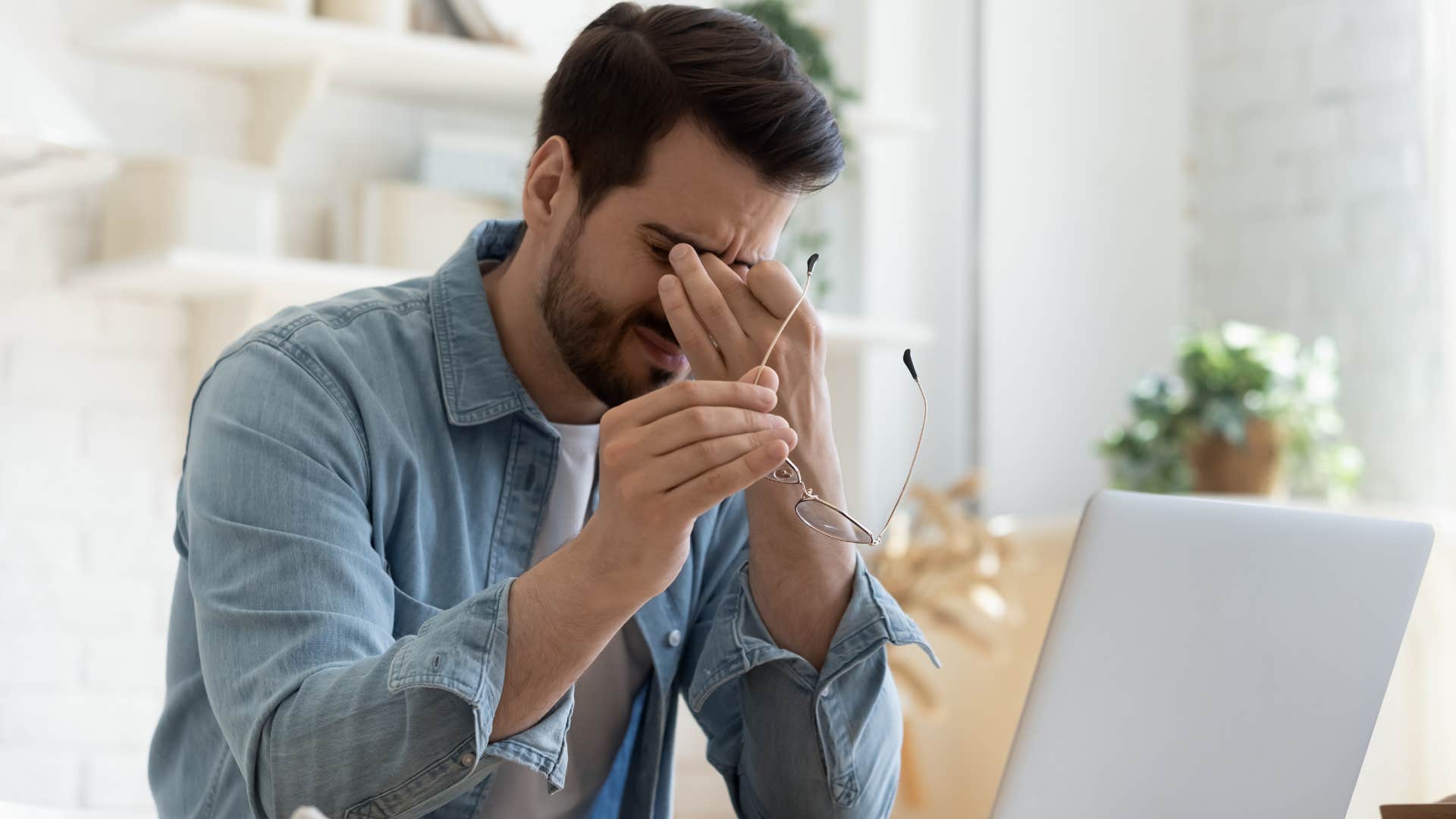 man who grew up in an unsafe family noticing signs of past trauma