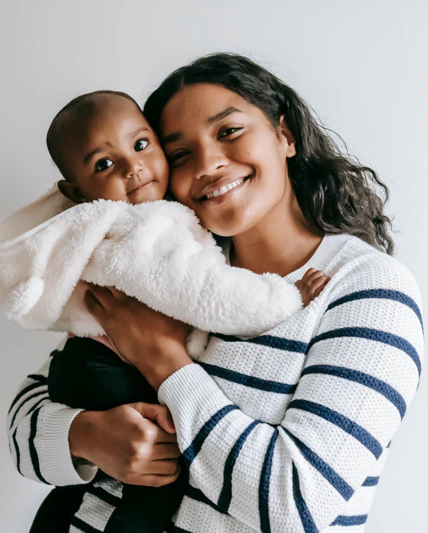 happier baby mom using old timey parenting trick