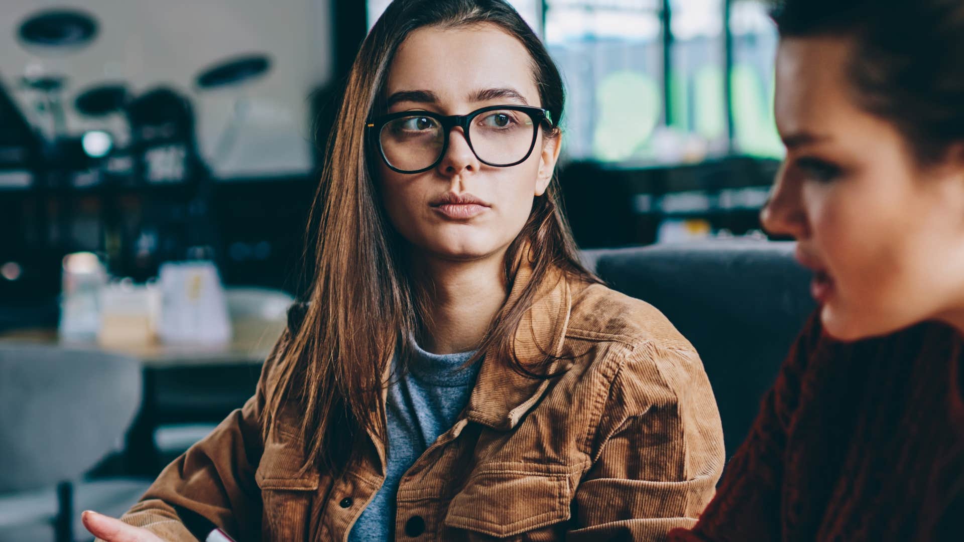Upset woman turning conversations into debates with a friend.