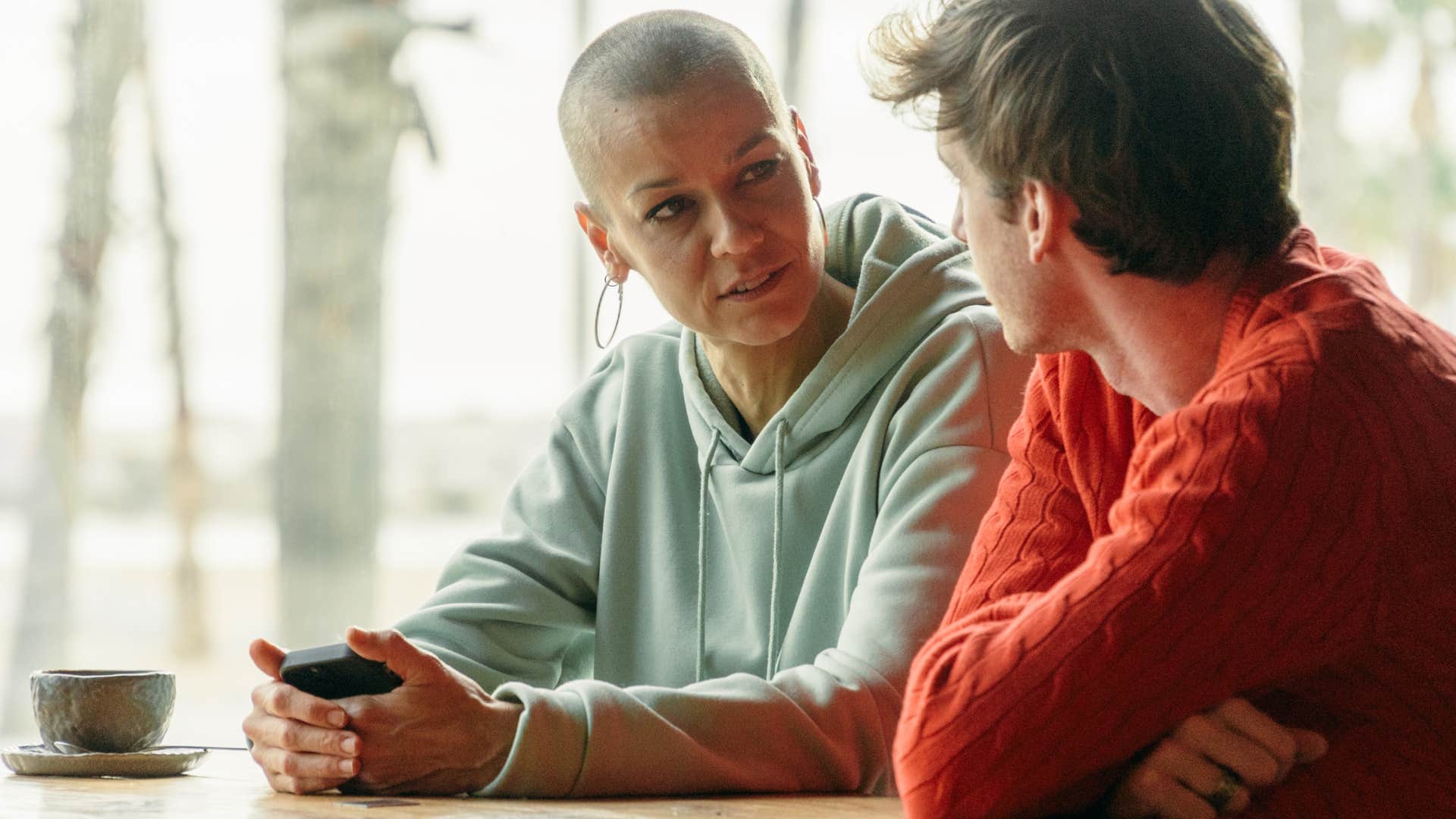 Woman playing Devil's Advocate in front of her teenage son.