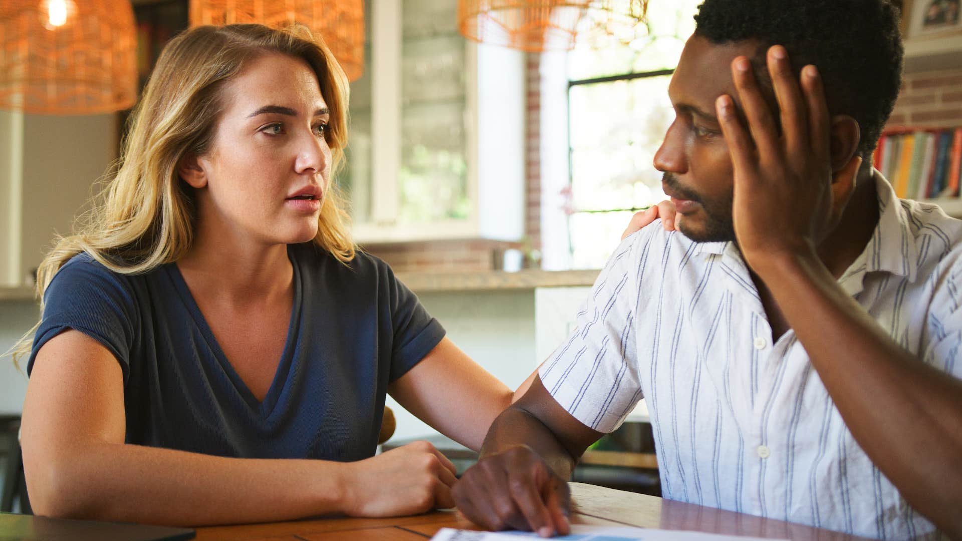 Woman dismissing emotions in a conversation with her partner.