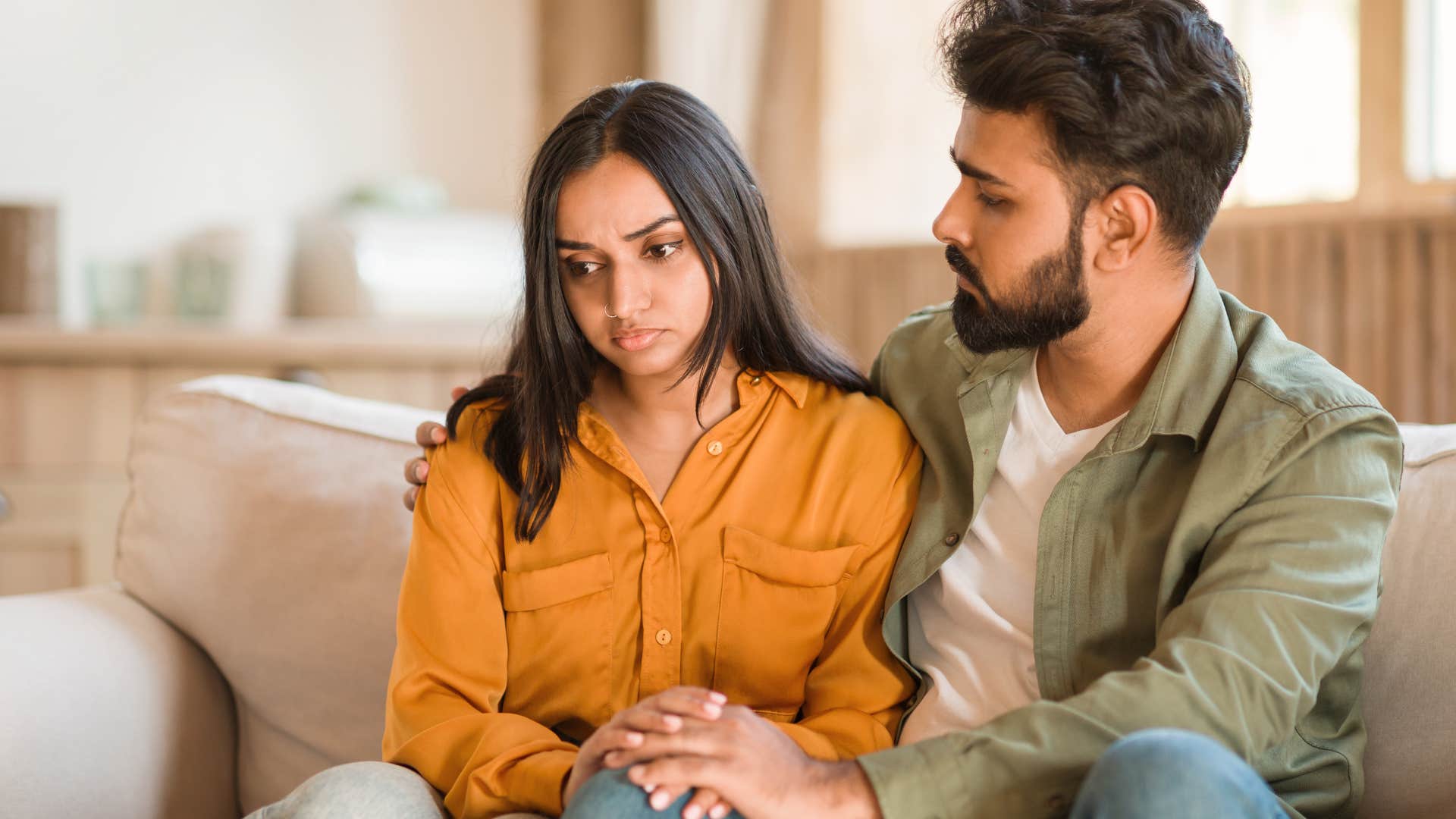 Woman overthinking casual decisions next to her husband.