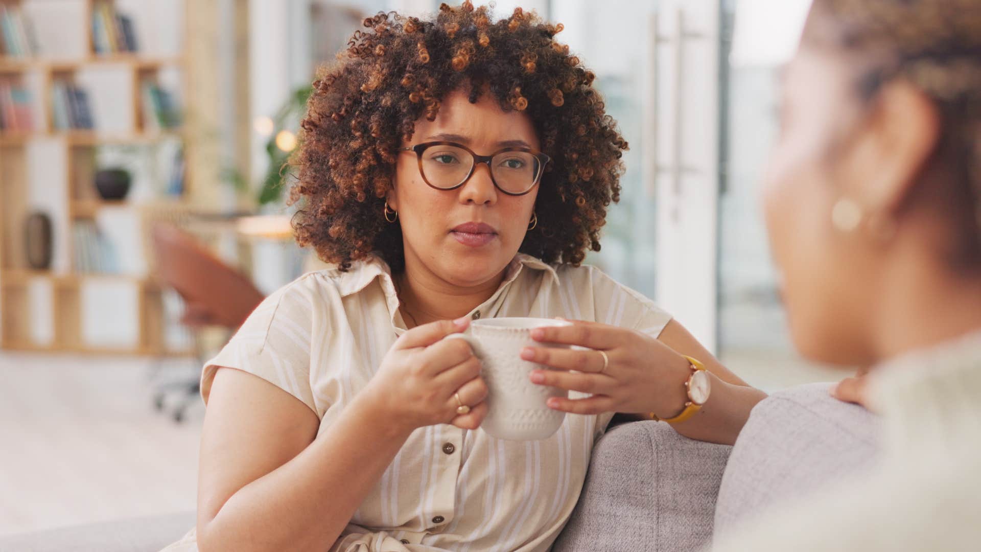 Woman using sarcasm while talking to her upset friend.