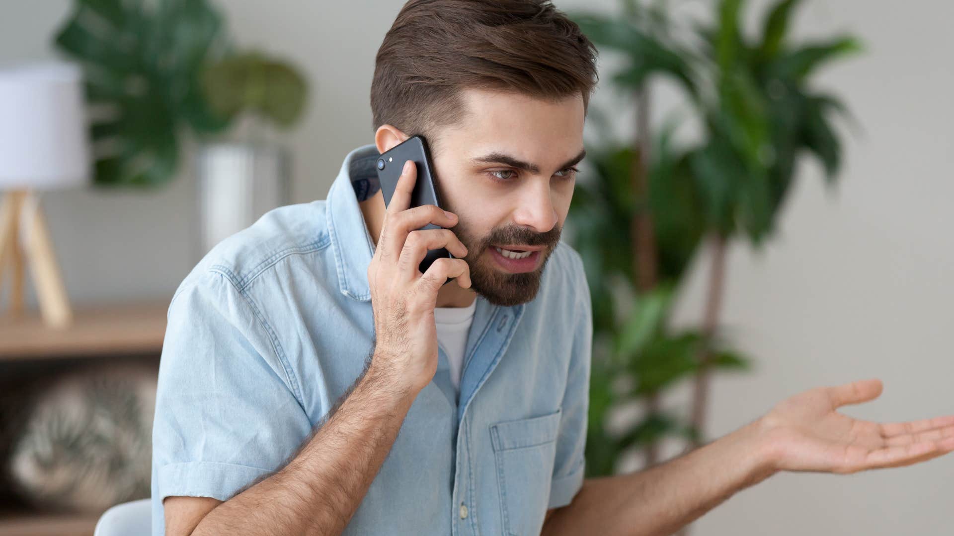 Man who's needing to win arguments talking on the phone.