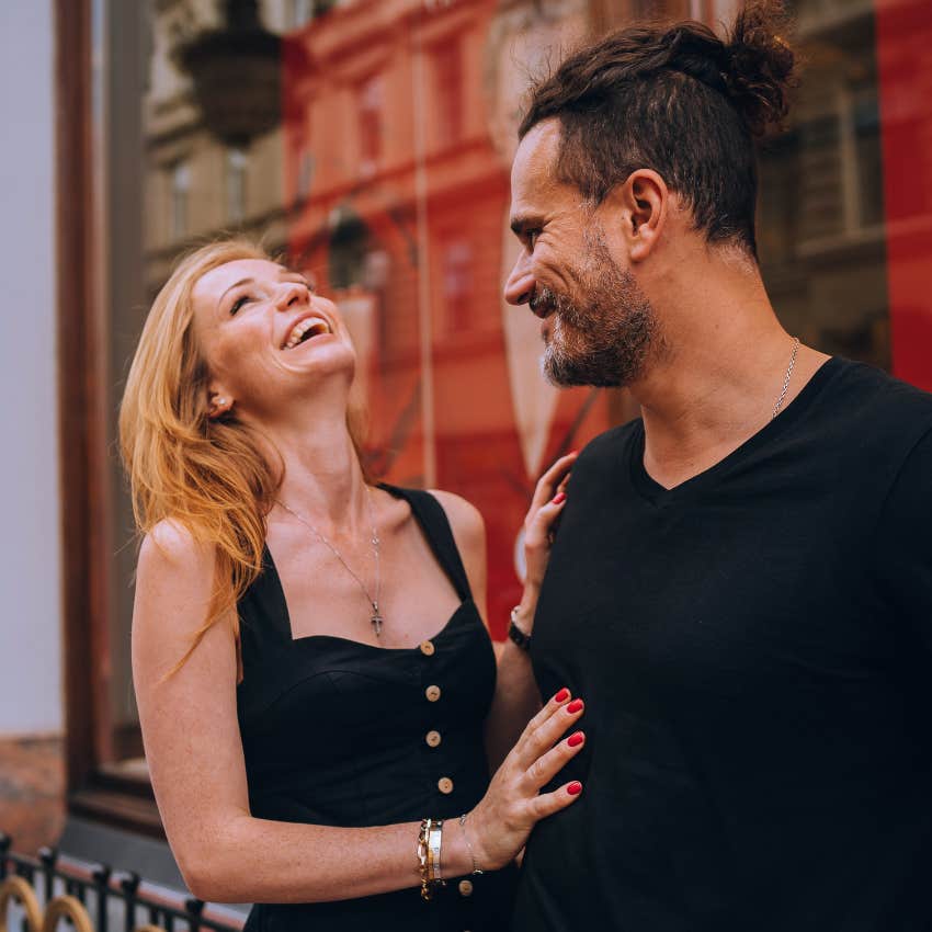 woman who is touching man as sign she's attracted to him