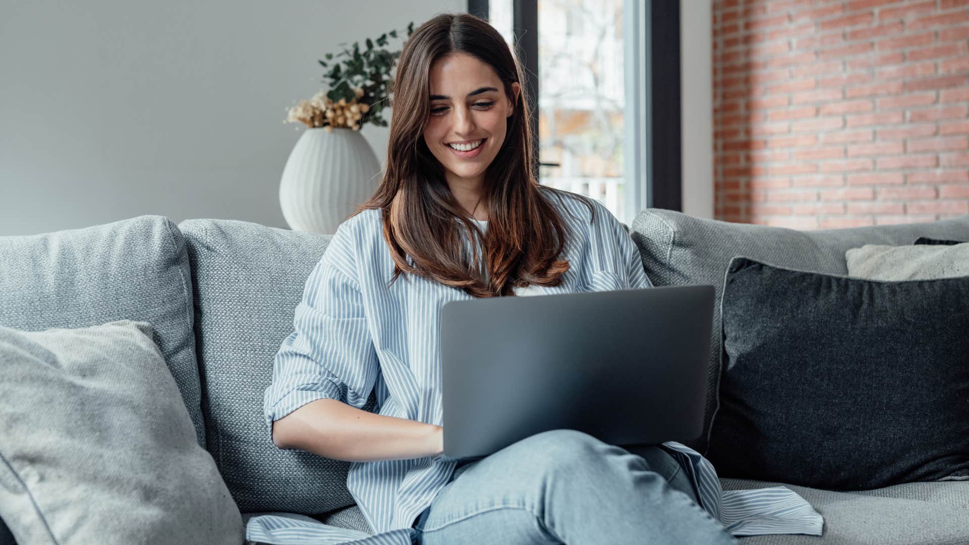 woman working on her laptop at home