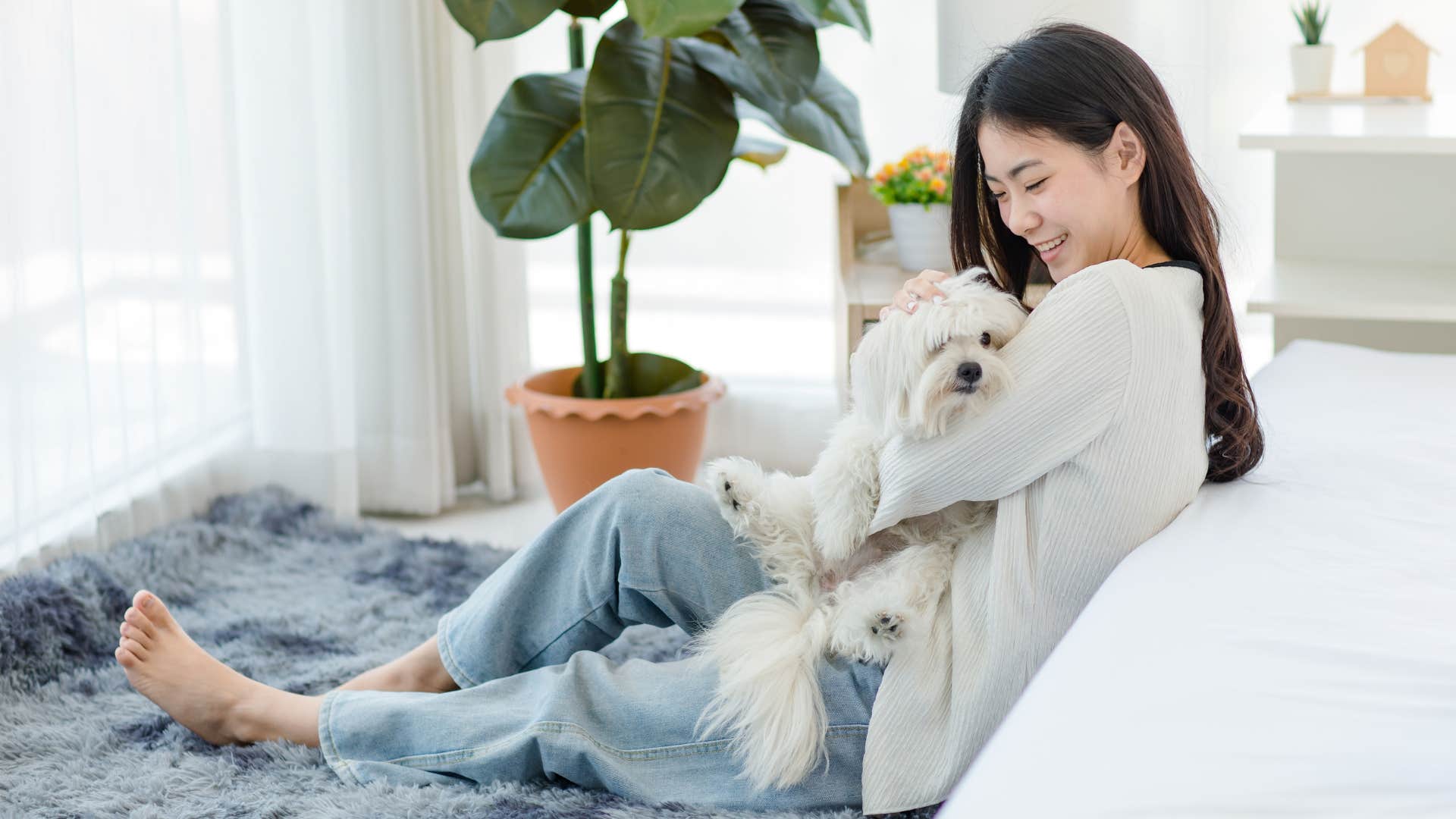 Person shares bed with pet for connection