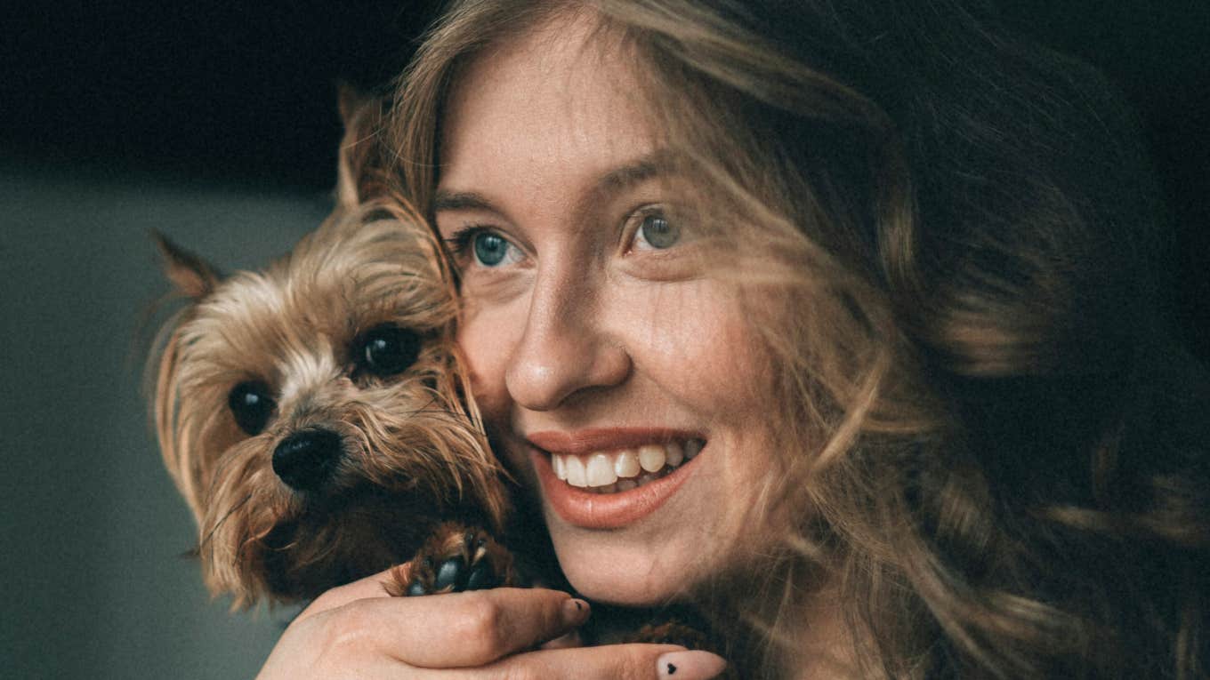 If You Treat Your Pet Like Royalty, Chances Are You've Got This Strange Personality Quirk Woman treats pet like royalty.
