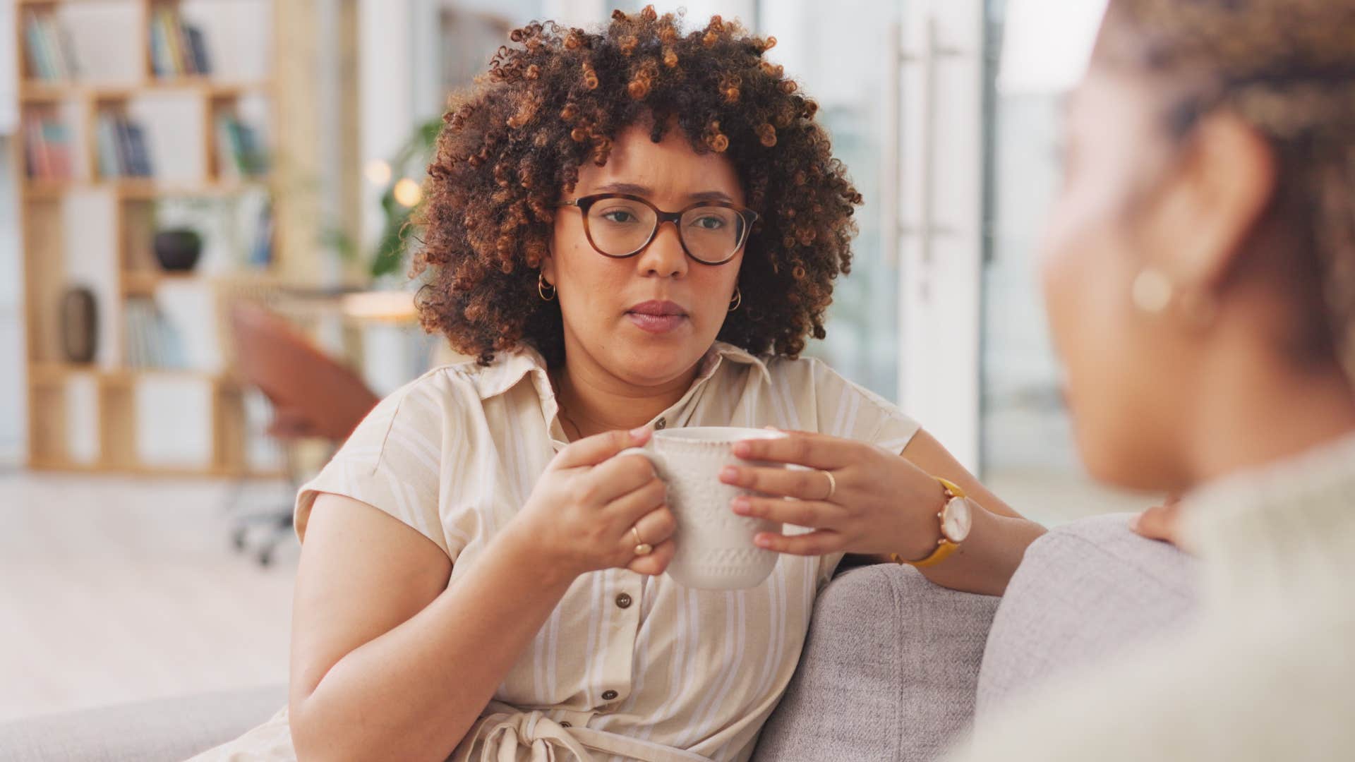 woman overthinking in conversation with a friend