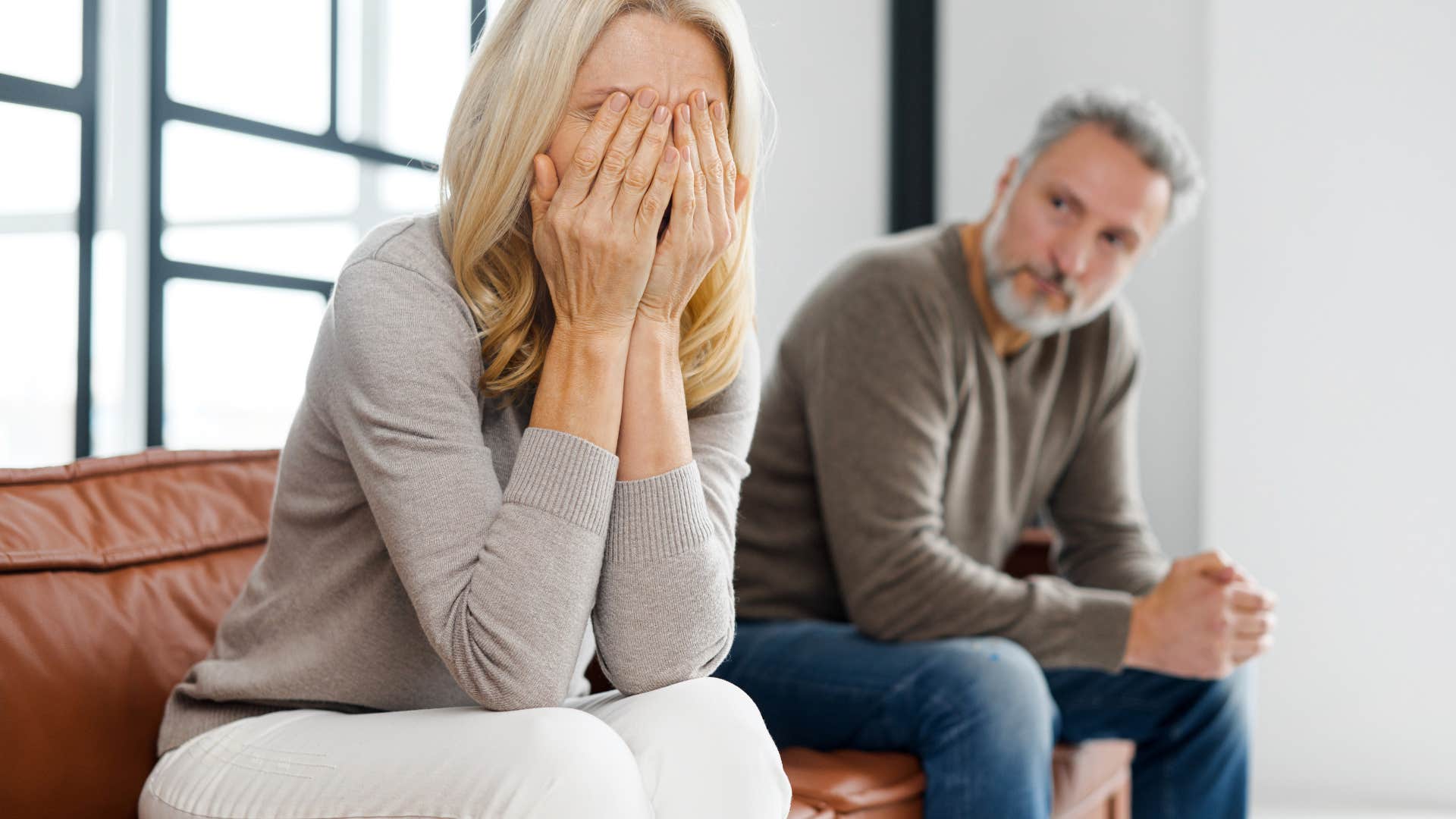couple in an unhappy marriage where woman is irritated
