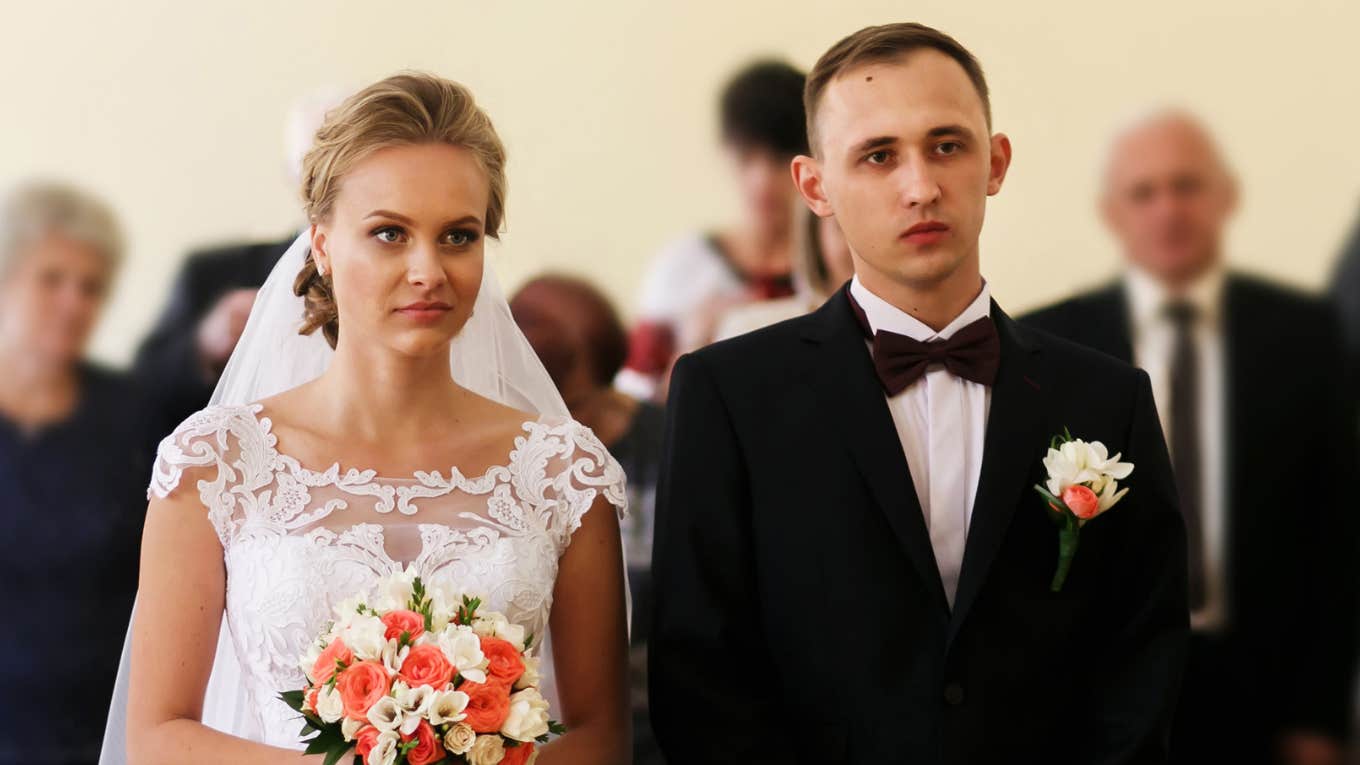 Woman Shares The Hot Take On Marriage She Got From A Divorce Lawyer Couple Looking Unhappy At Wedding While Woman Shares The Hot Take On Marriage She Got From A Divorce Lawyer