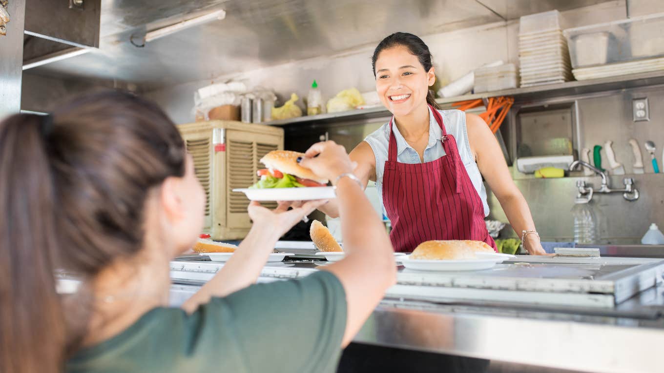 woman's family leaves bad review after she refuses discount woman working in food truck