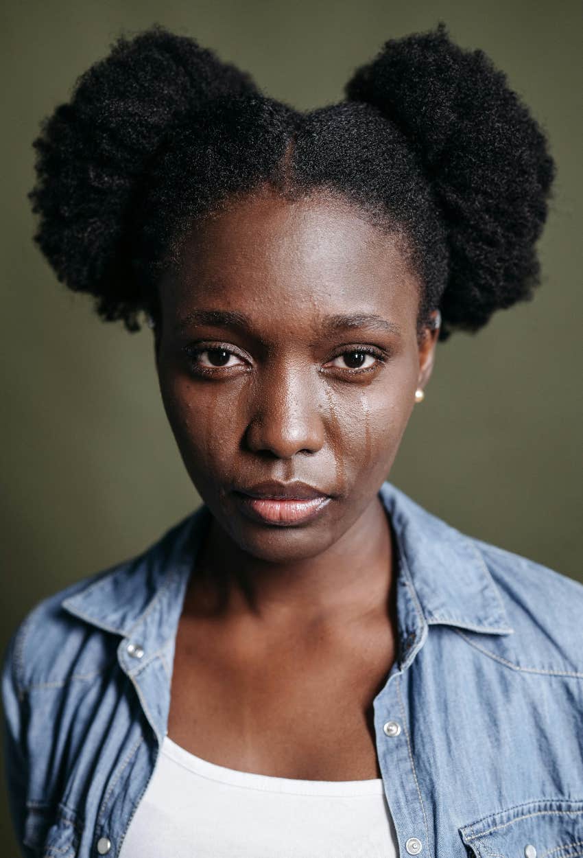 woman crying is protected by the universe and has better well-being