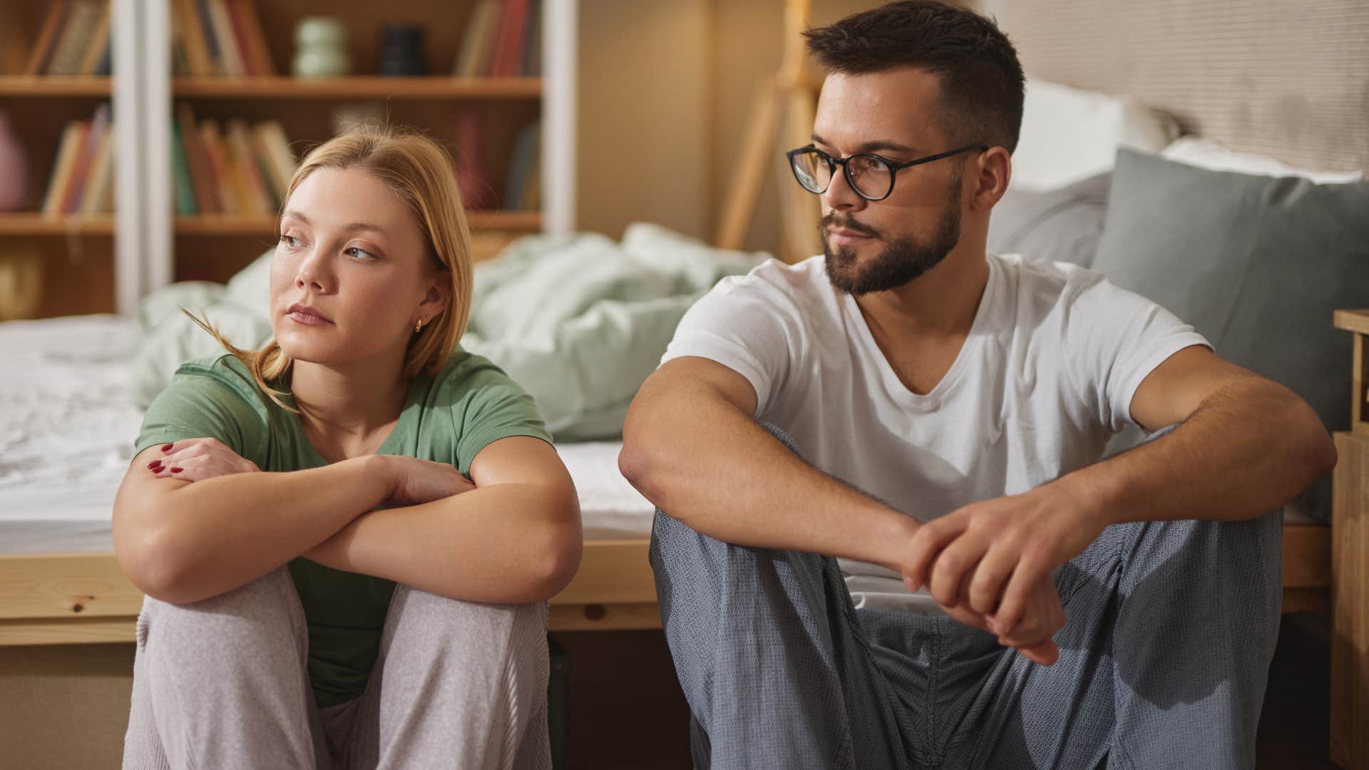 couple sitting close to each other but lacking intimacy
