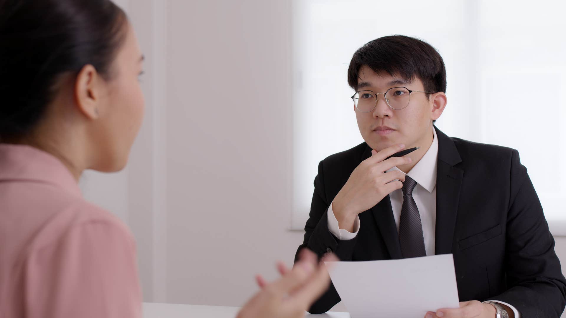 unempathetic boss listening to employee speak