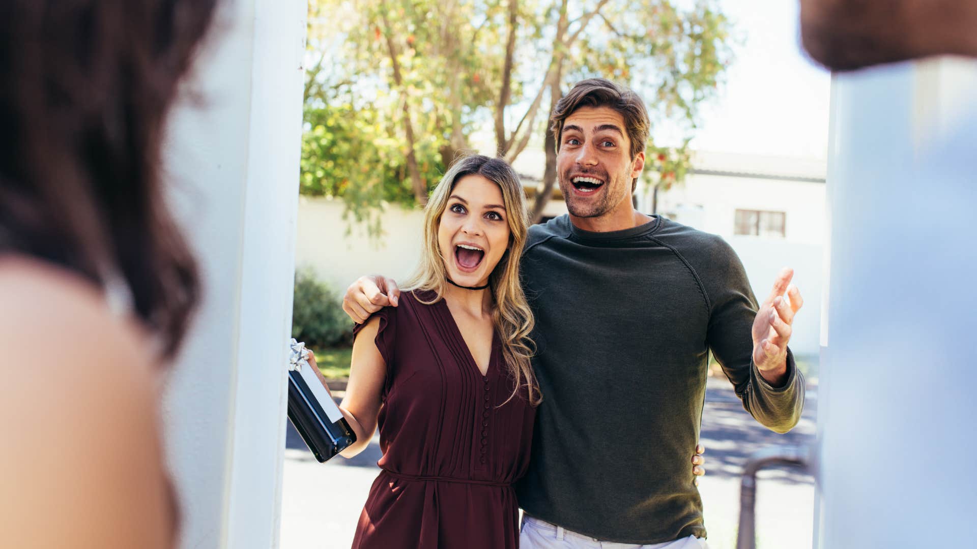 a couple visits their friends pretending to be happy when they are not