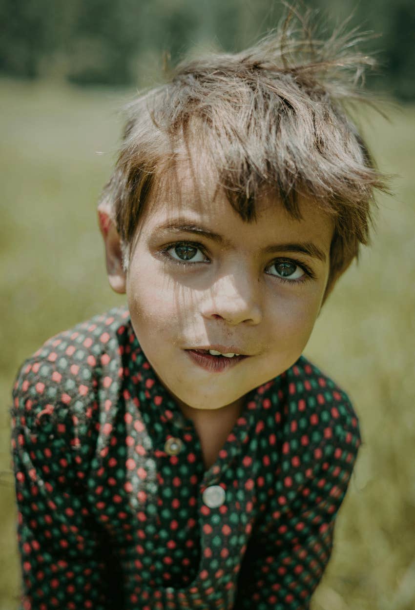 curious young boy learning by exploring
