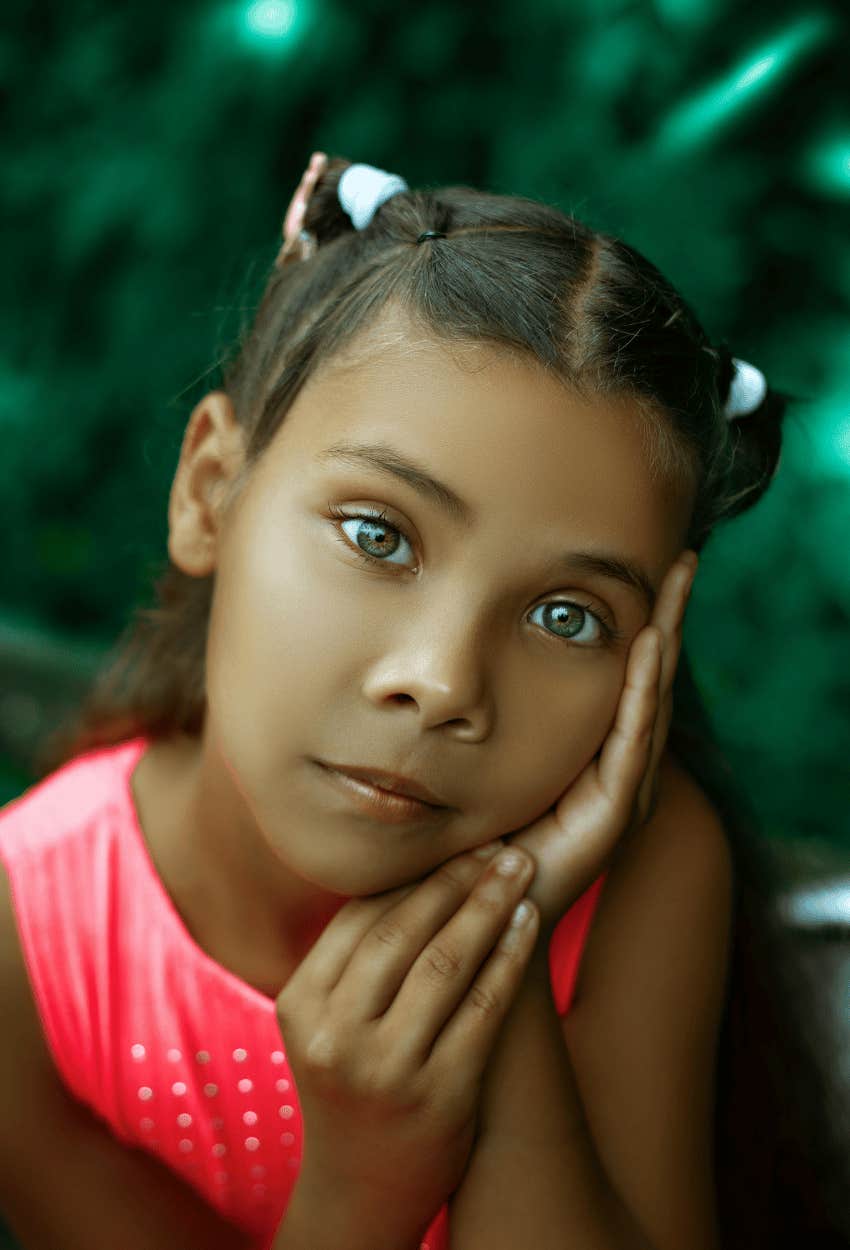 pensive young girl controlling her facial expression