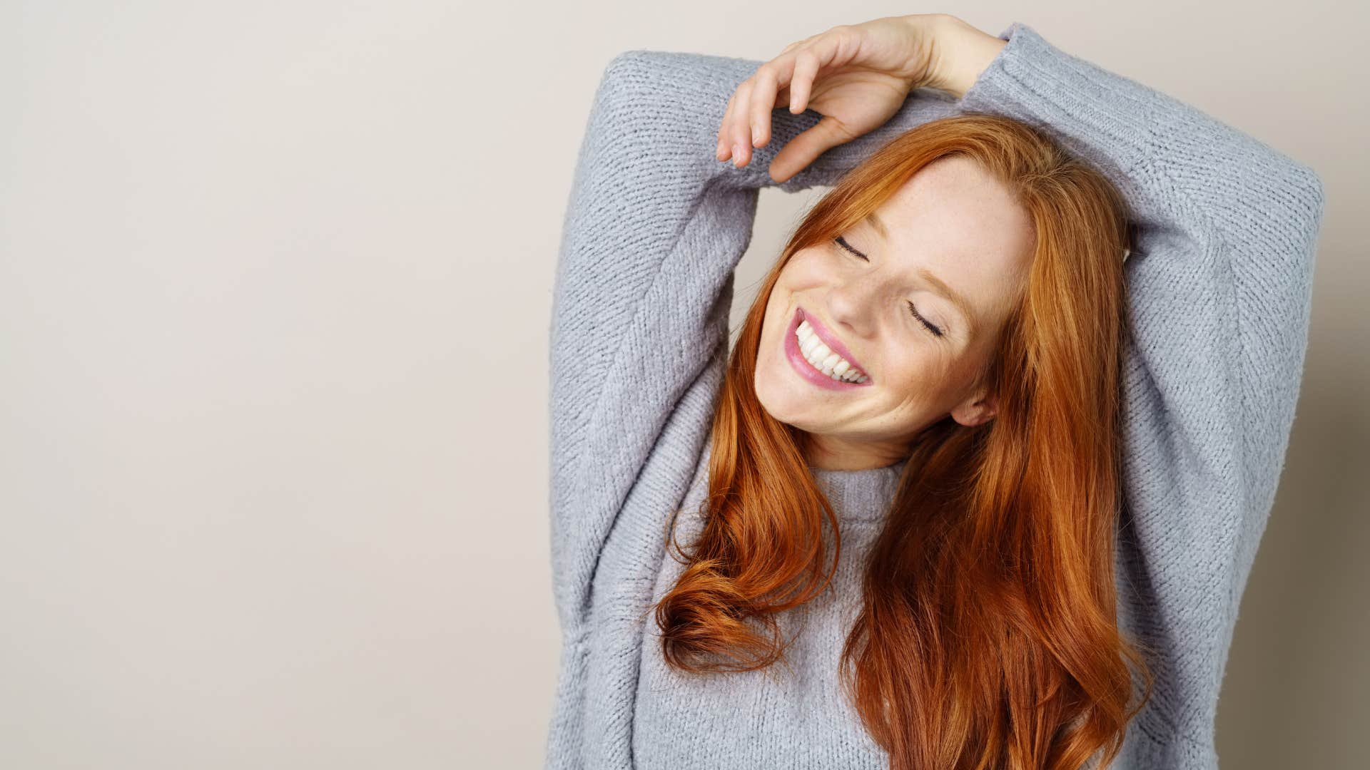 a woman loves her cotton sweater because it makes her feel comfortable