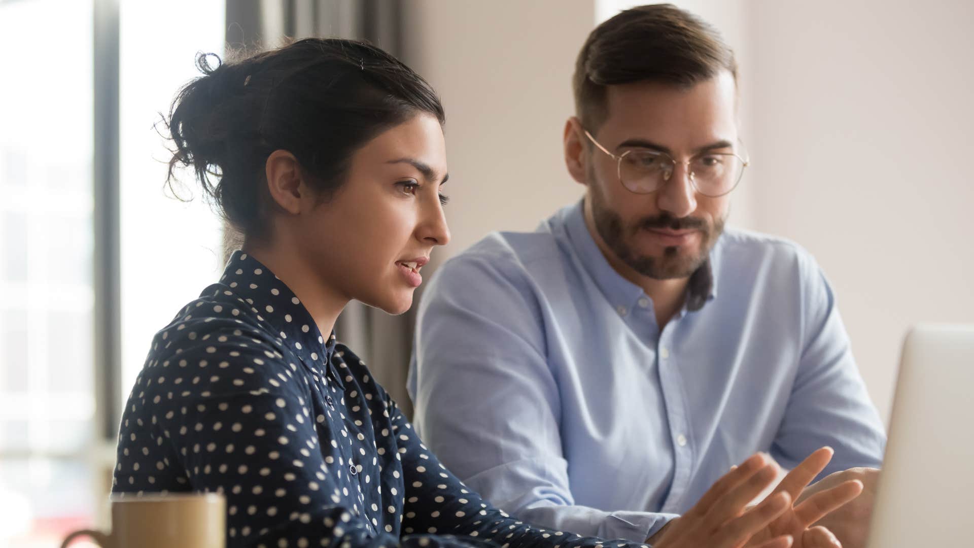 man accepting feedback from his co-worker