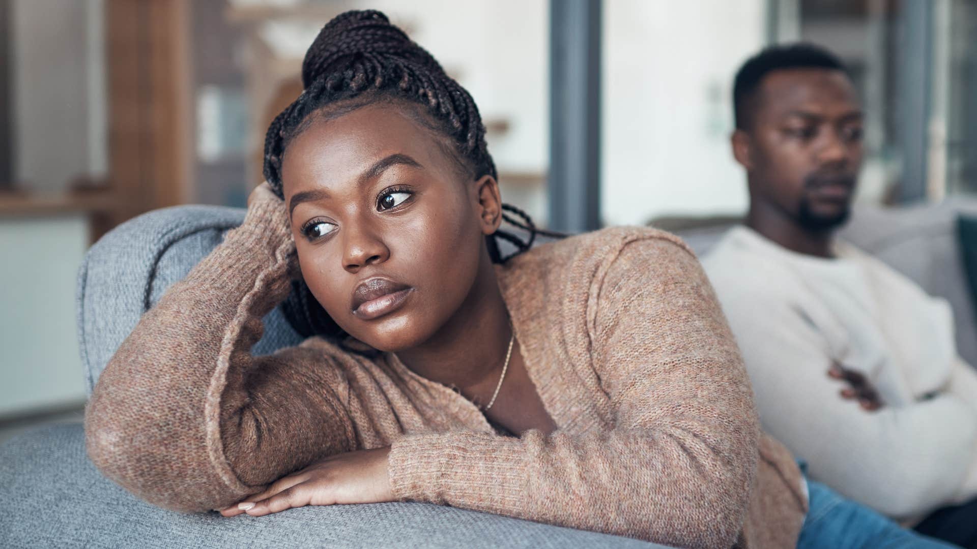 Woman turned away from her partner telling white lies