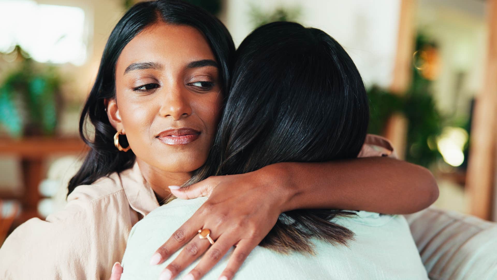 a woman struggles with telling her friend something that might hurt her